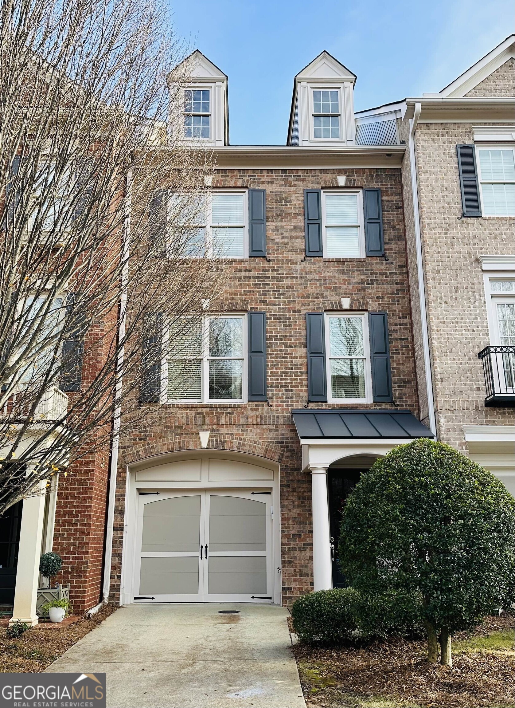 Unbeatable location! Just minutes from Alpharetta's most exciting dining, shopping, and entertainment, this stunning townhome puts you right in the heart of it all. Designed with style and comfort in mind, every detail shines from gleaming hardwood floors and elegant trim to custom lighting and thoughtfully desinged closets. Step inside through the welcoming foyer with direct access to the tandem garage. The main living level features a bright fireside family room with built-in shelving, a convenient office/study nook, and an open dining space that flows seamlessly into the kitchen. Your chef's kitchen is equipped with granite countertops, an island, stainless steel appliances,a gas range, and abundant cabinetry - perfect for everyday living or entertaining friends. Just off the kitchen, enjoy a private outdoor retreat for relaxing evenings. Upstairs, the primary suite offers a spacious sitting area framed by windows, a spa-inspired bath with dual vanities, a Jacuzzi tub, and a separate walk-in shower. A private secondary suite adds comfort and flexibility. Enjoy a low-maintenance lifestyle with incredible community amenities - pool, fitness center, clubhouse, and green space. Outdoor lovers will appreciate nearby Big Creek Greenway. Concerts, dining and shopping are just minutes away at Avalon, downtown Alpharetta and Ameris Amphitheatre. This isn't just a home - it's the lifestyle you've been waiting for.