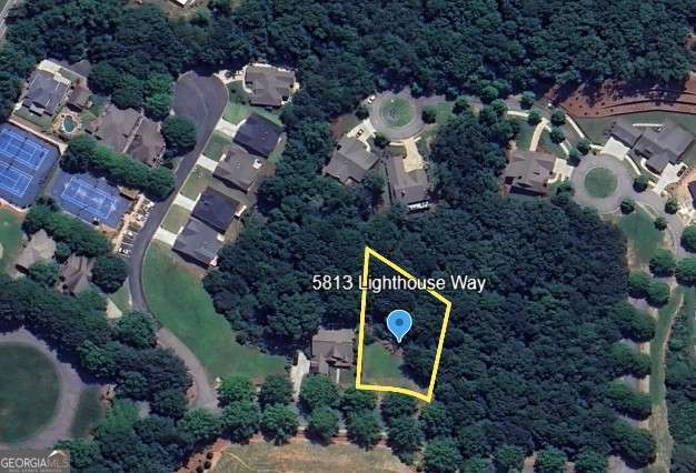 You've found your chance to secure one of the final lots in Marina Bay! This fantastic half-acre lot offers plenty of room and is a quick, 2-minute walk to the pickleball courts. Plus, an optional Marina Bay Boat Slip License is available for an additional $95,000. We have a beautiful home plan that checks all the boxes selected for this lot. The home design is created by one of Hall County's premier custom homebuilders - Harcrest Homes - This home design is a timeless modern open concept with space for a private swimming pool in the backyard. Ask us about sending you the Hampton Home plan for this lot. This lot features gentle topography, making it easy to build your dream home. Its beauty is perfectly complemented by the natural splendor of Marina Bay's tree-lined streets and lush amenities, all within a gated community of just 251 families. Annual HOA fees are $3,000, with an additional $500 for the boat slip maintenance. Marina Bay homes boast timeless architecture and access to award-winning resort-style amenities, including: A saltwater pool with a cabana and outdoor fireplace A fitness center A 14,000-square-foot clubhouse A 196-slip marina Tennis and pickleball courts Sidewalks and parks A tot lot. Our community also has architectural controls and an active HOA with professional management and year-round activities. - The Best of Lake Life - Marina Bay offers the perfect blend of year-round fun and serene tranquility. You'll find a warm, welcoming community of lake-life friends here. Our family has had more lake time than we ever imagined! Living on the North Shore of Lake Lanier also gives you easy access to the exciting North Georgia Mountains lifestyle. Come be a part of our wonderful community! There's something for every member of the family, and our professionally managed HOA helps us maintain an active calendar of fun activities throughout the year. Imagine hopping in your golf cart and being on the lake in five minutes. Or, better yet, enjoying the resort-style saltwater pool with its waterfall and beach entry, or getting in a great workout at our full fitness gym. You'll love evening walks on the tree-lined streets and chatting with the friendly families who adore their lake lifestyles here in Marina Bay.