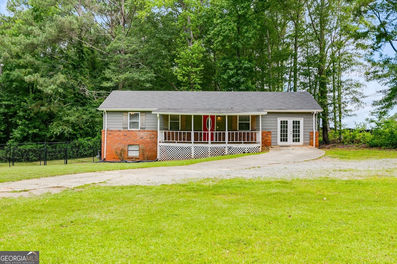 Conveniently located 3-bedroom 1.5 bathroom home minutes from UWG that sits on 1.24 acres. The home has 3 bedrooms and 1 bathroom on the main level, along with 2 living areas. Downstairs, there is a half bath and a large bonus room with its own entrance that would be perfect for a teen suite, man/woman cave, game room, or gym! Covered front porch. The back yard and side yard are fenced in and have a partition in case you need to keep your pets separated.