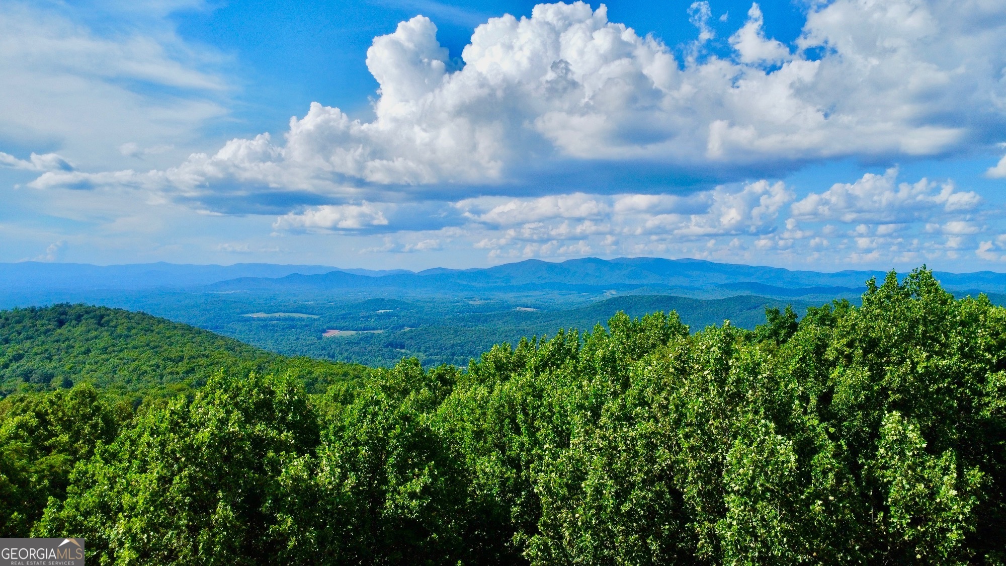 Discover an exceptional opportunity to build your dream home in the prestigious Georgia Highland, a luxury mountain community in Ellijay Ga. This expansive 4.5-acre lot offers the perfect blend of privacy & breathtaking year-round MOUNTAIN VIEWS. Enjoy tree-lined paved roads & the convenience of underground utilities, including electric, internet and phone. Experience the serene beauty of mountain living while remaining close to the charming towns of Ellijay & Jasper. You'll have access to delightful apple houses, fantastic dining options, shopping, schools and hospitals-all just a short drive away! Outdoor enthusiasts will be in paradise, as this community is nestled at the foothills of the Appalachian Mountains. Enjoy a range of outdoor activities, including tubing, kayaking, hiking, horseback riding, water sports and more. This is your chance to embrace the lifestyle you've always dreamed of-make it a reality today!
