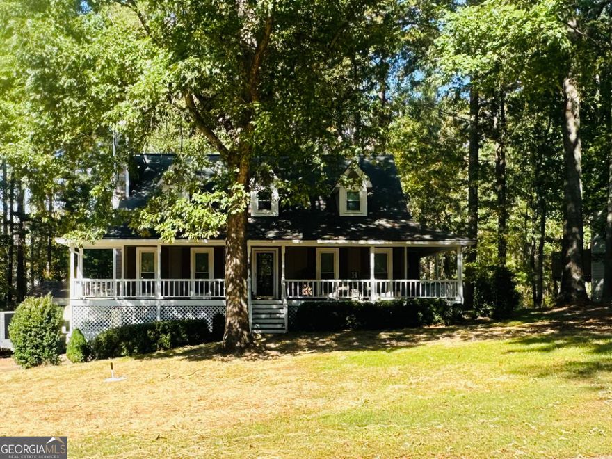 Nestled in a peaceful, well-established neighborhood, this beautiful home has so much to offer. Enjoy relaxing on the large covered front porch that wraps around to the side, perfect for morning coffee or evening gatherings. Inside, hardwood floors flow throughout the main level, accented by elegant crown molding and a cozy wood-burning fireplace. The kitchen features stainless steel appliances, granite countertops, and plenty of workspace.  The primary suite on the main level offers LVP flooring, a spacious bath with double vanity, tile floors, a separate soaking tub and large walk-in shower. Upstairs are two oversized bedrooms and a full bathroom, offering plenty of space for family or guests. The finished portion of the basement includes its own heating and cooling system and a bar area-ideal for entertaining or additional living space.  Outside, you'll find a recently upgraded back porch overlooking a fenced backyard, with the property line extending into the private wooded area beyond. A 36x30 insulated shop with heating, cooling, and epoxy floors provides endless opportunities for work or hobbies. Additional highlights include all HVAC systems less than six years old and a newly upgraded seven-chamber septic tank.  This home perfectly blends charm, functionality, and potential-ready to welcome its next owner. **Professional photos will be added 10/21/25**
