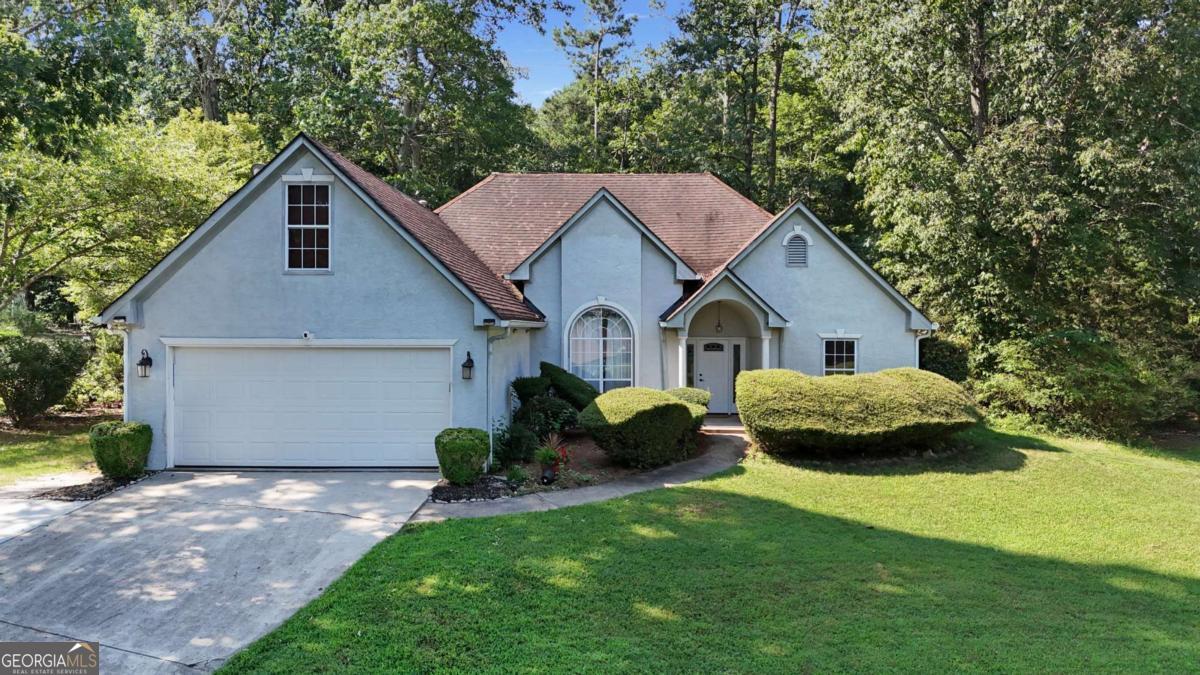 Welcome to this beautifully maintained 3-bedroom, 2-bathroom home with a cozy bonus living area, nestled in the sought-after community of Lake Spivey, it won't last long! This residence effortlessly blends timeless charm with modern sophistication, offering a lifestyle of comfort and convenience. As you step inside, you are greeted by expansive, light-filled living areas highlighted by beautiful flooring and soaring ceilings that create a warm and inviting atmosphere. The spacious layout is designed for effortless living, with an open-concept flow from the huge family room to the formal dining room - the heart of the home and a fully updated modern kitchen featuring sleek countertops, stainless steel appliances, beautiful soft-close cabinetry with under cabinets lights and crown molding, and a breakfast area perfect for casual dining or entertaining. The spacious primary suite is conveniently located on the main level, offering a serene retreat boasting a tray ceiling which makes the room feel even larger, a walk-in closet, and a beautifully renovated en-suite bathroom with a soaking tub, separate shower, and double vanity. Two additional bedrooms one on the main and one upstairs provide plenty of space for family or guests, while the versatile main bonus room serves as an ideal living room, fourth bedroom, home office, playroom, or flex space, adaptable to your lifestyle needs. With ample closet space and abundant storage throughout, a generous laundry room, and 2-car garage, ensuring organization is effortless and practicality is met with ease. The large outdoor space features a private backyard oasis and patio perfect for gardening, relaxing, hosting gatherings or a quiet morning cup of coffee under the stars. Located in the well-maintained and quiet Lake Spivey Glen community, this home is surrounded by peaceful tree-lined streets and friendly neighbors. Just minutes from Lake Spivey Park and Reeves Creek Trail, outdoor recreation is always close at hand. The home is also conveniently near Spivey Splash Water Park, shopping centers, local eateries, and top-rated schools, with easy access to I-75, making your commute to downtown Atlanta smooth and stress-free. This is more than just a home - it's a lifestyle of comfort, space, and modern elegance in one of Henry County's most desirable neighborhoods.