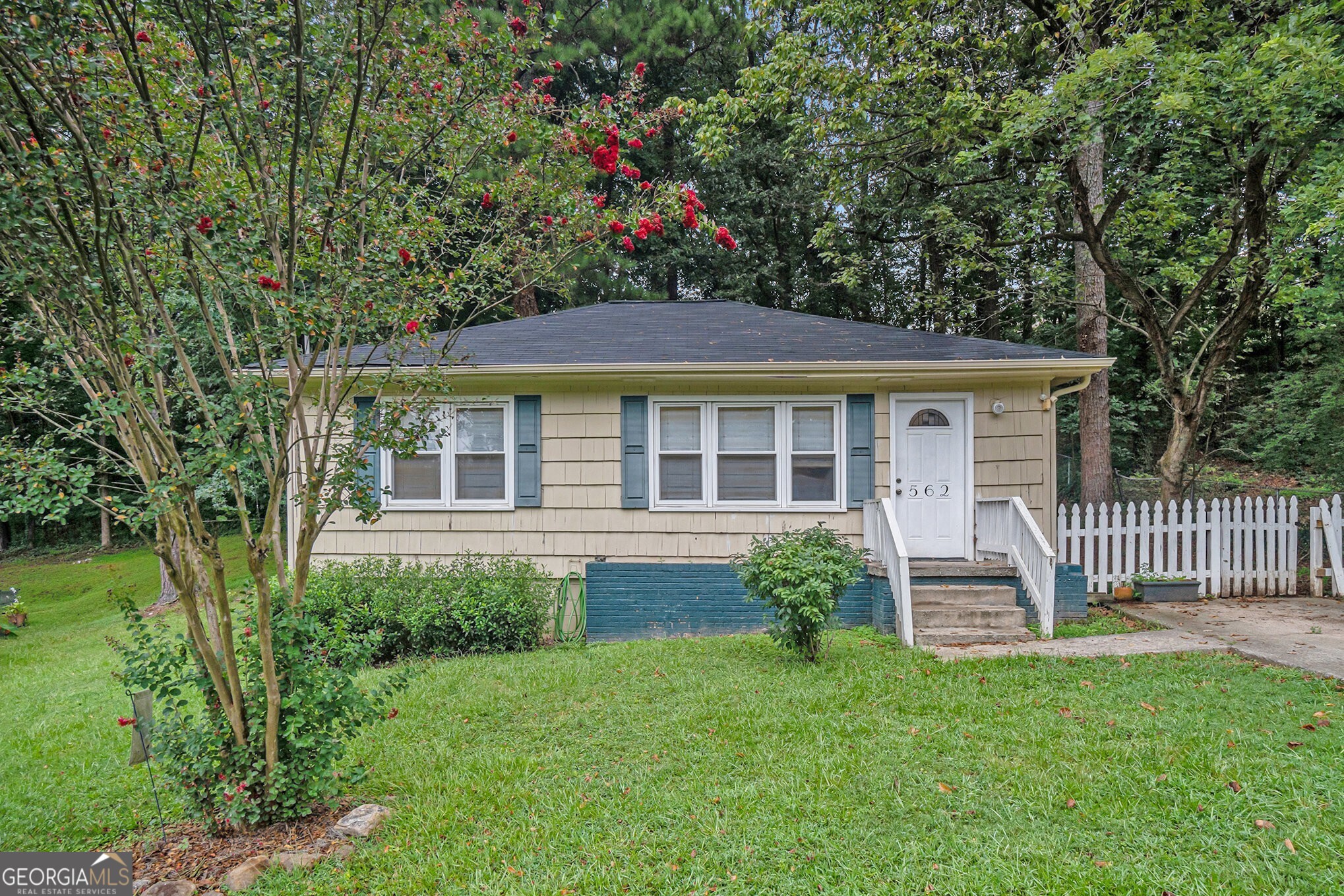 Charming Cottage Living with Easy Access to Marietta Square! Tucked in a prime Marietta location, this delightful 2-bedroom, 1-bathroom cottage is full of warmth, character, and everyday convenience. With easy access to Marietta Square, Kennestone Hospital, and the local Shops, Restaurants, and Parks that give the neighborhood its charm, this home offers the ideal blend of lifestyle and location. Inside, you'll find beautiful Oak Hardwood Floors, Crown Molding, and a sun-drenched living room that creates an inviting first impression. The Open-Concept Living and Dining Area flows seamlessly perfect for everyday living or entertaining guests. Two Spacious Bedrooms offer flexible options for a Home Office or visitors, with a Shared Full bathroom. Step outside to your Private Backyard retreat complete with a Deck ideal for outdoor dining and a fully fenced yard with room to garden, play, or unwind. All just minutes from I-75, Truist Park, and everything Marietta has to offer. Don't miss your chance to own this charming gem in one of Cobb County's most convenient locations! Seller is motivated and offering a 1-year Home Warranty - we'd love to work with you!
