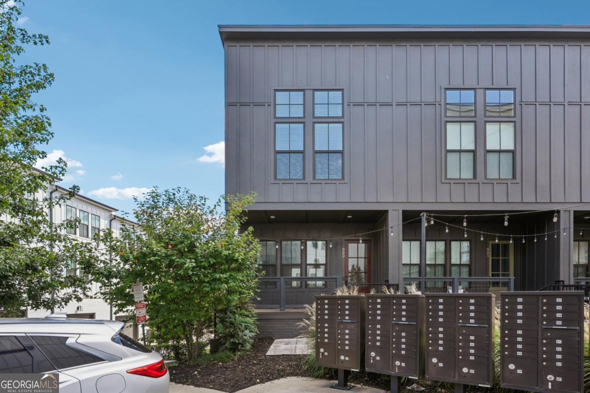 Have you been searching for the perfect place to create new memories? Welcome to 903 Brees, a like-new end-unit townhome in the heart of West Midtown! Sun-filled and stylish, this home is only a few years old and showcases premium builder upgrades throughout. On the main level, gather with friends for game night, unwind after work, or enjoy quiet moments in the open living space. The chef's kitchen features a large quartz island, abundant cabinets, and plenty of room for meal prep, book club gatherings, or even hosting your fantasy football crew. The terrace level offers a tandem 2-car garage with generous storage space. Upstairs, you'll find two spacious bedrooms, including a primary suite drenched in natural light, a secondary bedroom, two full baths, and a convenient stackable washer and dryer. Community amenities include a shared green space and a cozy fire pit-perfect for crisp fall evenings. All this, just steps from restaurants, shops, Georgia Tech, and the best of Atlanta's Upper Westside. The icing on top: a low monthly HOA and home maintenance costs. This community is investor-friendly with long-term potential! Rental restrictions permit 12-month minimum leases. Whether you're moving in or building your portfolio, this is a rare chance to own a beautifully maintained home in an unbeatable location. Ask about our buyer incentives to make a great deal even sweeter!