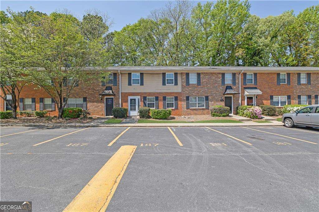 The only townhouse property in Northdale Condos, with 1,320 square feet, offers 3 BEDROOMS AND 2.5 BATHROOMS, spread OVER TWO LEVELS. The interior features hardwood floors, an electric fireplace, and a kitchen equipped with appliances such as a dishwasher, dryer, microwave, gas oven/range, and refrigerator** The property includes 2 ASSIGNED PARKING SPACES and is located on a 0.01-acre lot. The HVAC system is centrally controlled for both heating and air conditioning. The monthly HOA fee is $228, which covers maintenance of the structure, common areas, and private roads** This property is close to several Gwinnett County public schools, including Lawrenceville Elementary School, Moore Middle School, and Central Gwinnett High School. Properties with these features and in this area fly off the market*** ***Schedule your visit today with your agent and come discover in person what photos can't capture: the place where the best stage of your life can begin. Schedule your tour. Because once you see it... you won't want to let it go.