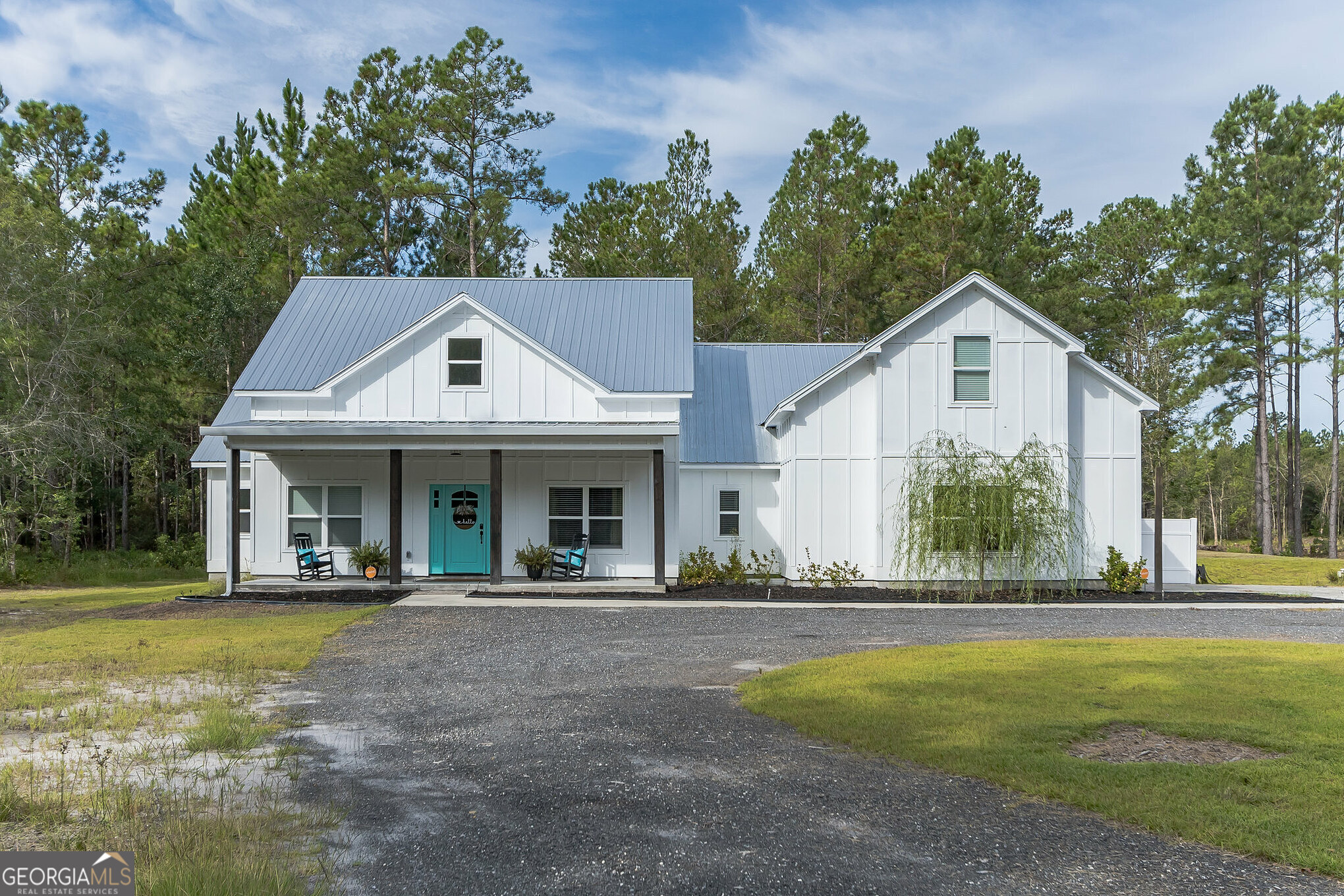 Discover a Modern Farmhouse situated on 6.67 acres, boasting just under 3000 heated square feet. This custom-built home, completed in 2018, features an open floor plan. The expansive great room merges seamlessly with the kitchen and dining area, complete with bar seating, stainless steel appliances, quartz countertops, a shiplap-style backsplash accentuated by under-cabinet lighting, and a sizable walk-in pantry. The kitchen is a model of convenience with its ample cabinetry and pull-out drawers along with recently updated refrigerator.Adjacent to the kitchen lies an eat-in breakfast room. The main foyer opens to a versatile guestroom/media room/office, with the formal dining area situated across. A hallway extends from the great room to two guest bedrooms that share a full bathroom. The master suite is generously sized, and the en suite master bathroom features a clawfoot soaking tub, a tiled shower, dual vanities, and a separate powder room. The master closet provides a passageway to the laundry/craft area, and above the garage, a spacious bonus room awaits. The HVAC system was recently replaced. This home is rich in details and is a must-see property.