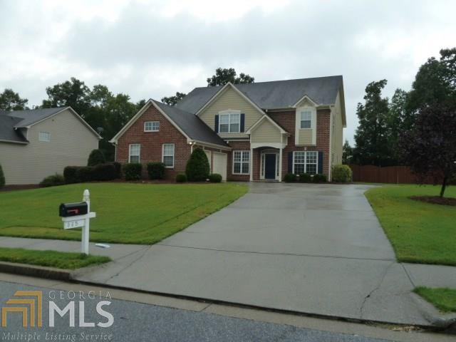 Large, well maintained home in great neighborhood! Main level has formal dining room, living/flex room + separate office w/ double doors all with new wood floors. Kitchen has huge island with neutral corian countertops, tons of wood cabinets, built-in desk, 18" diagonal set tile floors, walk-in pantry & open to 2-story family with fireplace & dramatic overlook from upstairs. XXXL laundry room finishes the main floor. Upstairs has a Huge master suite with his & hers closets, whirlpool tub & separate shower. Bedrooms 2, 3 & 4 are spacious with ample closets. Nice flat yard with sprinkler system, oversized deck & fence. Both a/c's new, Move-In Ready!