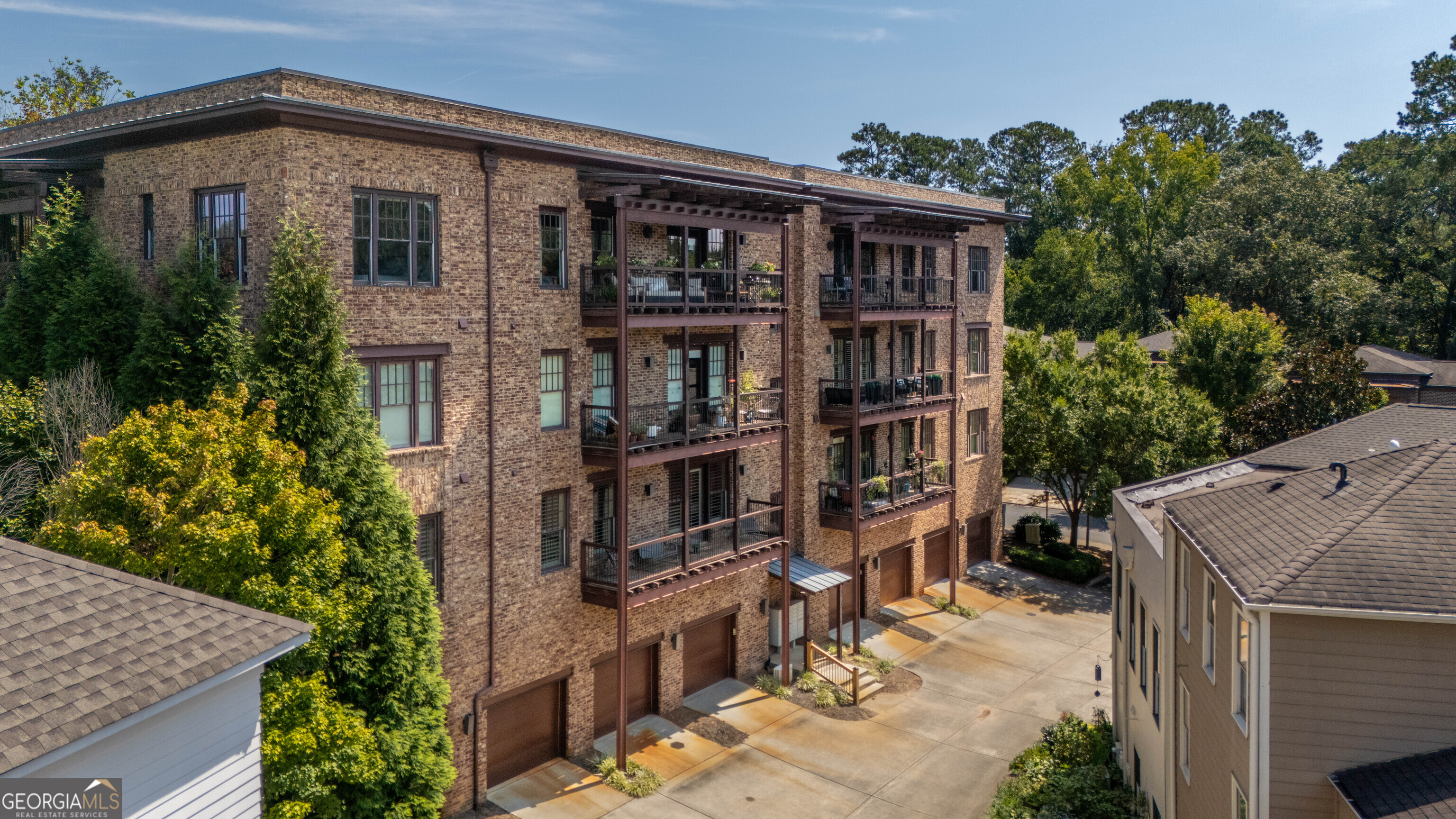 Luxurious Top-Floor Condo in the Heart of Vickery | 5920 Bond Street #407 Experience elevated living in this stunning , updated ,top-floor residence located in the heart of Vickery Village, one of Forsyth County's most coveted communities. Situated at 5920 Bond Street #407, this impeccably designed 2-bedroom, 2.5 bath condo blends timeless elegance with modern convenience, offering unmatched walkability, panoramic views, and refined urban living. Step inside and be greeted by an open-concept floor plan with soaring ceilings, updated floors, new paint and an abundance of natural light. The gourmet kitchen features new granite countertops, custom cabinetry, stainless steel appliances, and a generous island-ideal for both casual dining and entertaining. The spacious living area flows seamlessly to a private balcony, perfect for enjoying morning coffee or evening sunsets over the vibrant village below. The primary suite is a tranquil retreat with a spa-inspired en-suite bath, complete with dual vanities, a frameless glass shower, and a walk-in closet with custom built-ins. A second bedroom offers flexibility as a guest suite, office, or den. Residents of 5920 Bond St enjoy secured access, elevator service, and dedicated garage parking, along with low-maintenance living just steps from Vickery's charming shops, fine dining, boutiques, parks, and the YMCA. Whether you're seeking a full-time residence or a lock-and-leave lifestyle, this exceptional condo offers the perfect balance of luxury, location, and lifestyle.