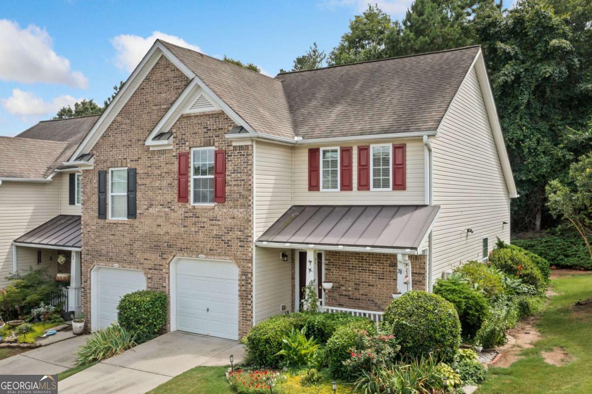 Great opportunity in Fox Creek, a townhome community located in popular Woodstock! This updated townhome includes a rare first floor primary bedroom and bath. Perfect for one level living with a second-floor guest suite or a roommate plan with each person having their own bedroom and full bathroom. Move-in and enjoy brand new luxury vinyl plank flooring on the main level and new carpet on the second floor. The home has been freshly painted throughout. Fully upgraded kitchen with white shaker cabinets, quartz counters, and stainless-steel appliances. The fist floor bathroom has been updated with a large walk-in shower, new vanity, and storage cabinet. The second floor features a large loft area for office or media use. The backyard has an oversized patio perfect for a small garden, grilling, or enjoying a cold beverage. Woods behind make the area very private. This is an end unit with a one car garage. The community amenities include a pool, tennis courts, and playground. Minutes to Woodstock downtown, Costco, the Outlet Mall, I575, and walking distance to shopping and restaurants!!