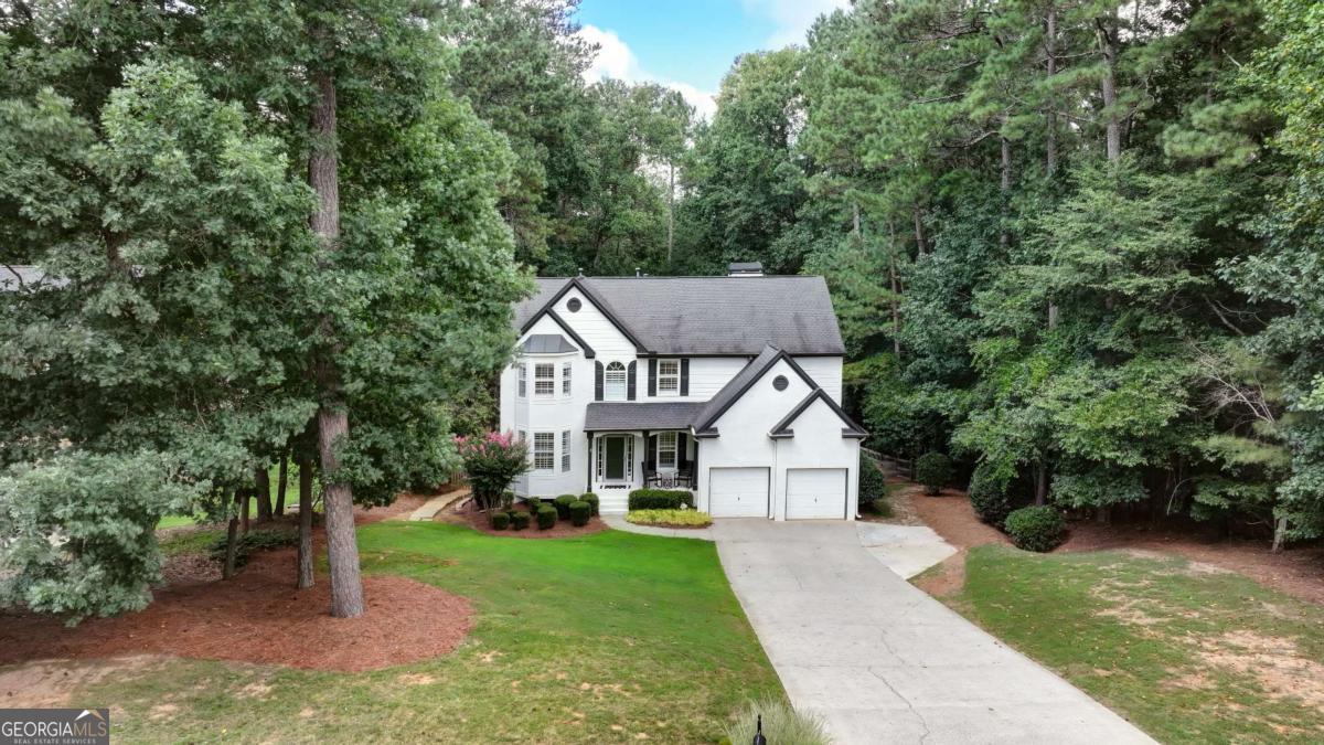 Beautifully updated home on 1 plus acre lot in sought after Sable Pointe. Enjoy rare opportunity for Milton/Milton schools with finished basement and great neighborhood amenities for under 1M! The main level features entry foyer, living room, dining room, powder room, open kitchen, great room, 9' ceilings, wood floors, plantation shutters, crown molding, gas fire place, and walk out to back deck with views of large fenced backyard. The kitchen renovation includes granite counters, stainless steel appliances, gas range, tile backsplash, farm sink, stained cabinetry, wine refrigerator, microwave, vent hood, large pantry, and peninsula with bar seating. Upstairs you find large primary bedroom with separate sitting room/secondary den, primary bathroom with glass enclosed tile shower, soaking tub, granite double vanity, large walk in closet with built in shelving, laundry room, linen closet, 3 large guest bedrooms, renovated guest bathroom, and upgraded wood floors. The finished daylight basement includes added cabinetry/counter space, additional guest bedroom, full bathroom, large den/recreation room, gym space, additional unfinished storage areas, upgraded wood floors, and walk out access to covered/dry-deck lower level deck and backyard. Additional highlights are cul-de-sac street, large/wide driveway, brick/hardie board construction, thermal pane windows, extra deep garage space, landscaped/private front and backyard, outbuilding for storage, and large neighborhood pool with ample decking/seating area within a couple minute walk from the home. Enjoy easy access to Milton, Dowtown Alpharetta, top schools, shopping, parks, GA400, and more.