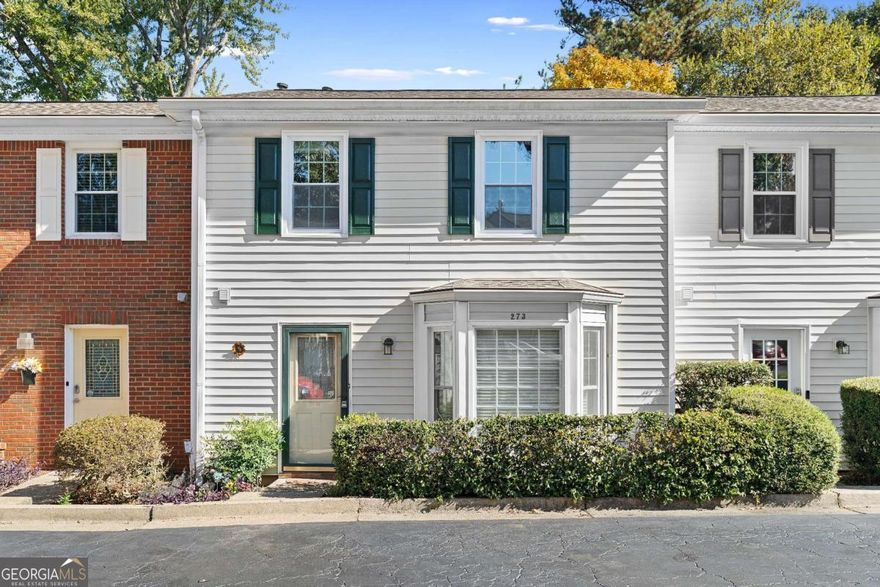 Welcome to this charming condo in the heart of East Cobb! This 2 bedroom, 2.5 bathroom home offers a comfortable and functional layout in a highly desirable location. The bright, eat in kitchen features white cabinetry, stainless steel appliances, and a large bay window that fills the space with natural light. The open main level includes a spacious living room centered around a classic brick fireplace and direct access to the private back deck, which is perfect for relaxing and entertaining. Upstairs, both bedrooms feature generous walk in closet space and ensuite bathrooms, creating an ideal roommate layout. Recent updates include newly installed windows throughout and brand new deluxe carpeting with upgraded padding, adding comfort and efficiency to this already well maintained home. Enjoy the convenience of nearby shopping, restaurants, and top East Cobb amenities, all within a welcoming community.