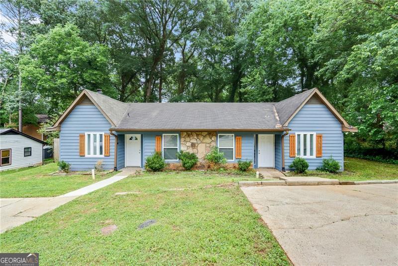 PRIME LOCATION DUPLEX 5 minutes to Marietta Square! Each side of duplex is 2 bedrooms 2 full bathrooms and a half bath for guest off main living area! Walk in closets in both units in both bedrooms, en suite bathrooms perfect for roommates or double master suites! As you walk in you'll notice the vaulted oversized living rooms in both units, bar area in 450 side unit and study/playroom area in unit 452! Unit 450 & 452 upgrades include new LVP flooring throughout, granite countertops, new toilets, newer paint, and drainage added! Loaded with storage including coat closets, linen closets, laundry room closets, and exterior storage sheds! Units just vacated for easy showings! Coveted Marietta High School district! 5 minutes to The square, I-75, grocery shops, dining, and parks!