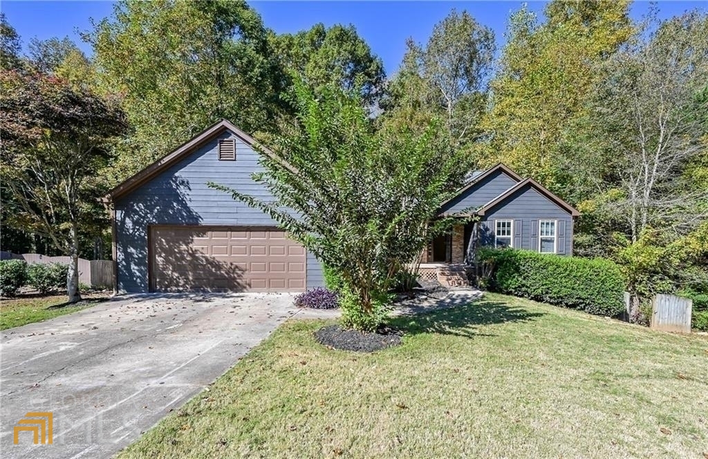 Totally renovated beautiful ranch home. This is an impeccable 5 bed and 2 full bath home. Modern features and a functional design include a large front porch and light-filled living zones. Top of line Stainless steel appliances will make cooking a pleasure, and an open design that connects you to the dining area and living room. You can relax on the front porch or the rear entertaining deck or the spacious, and private yard. Oversize master with double vanity and separate tub and shower. The basement has fully finished rooms and is stubbed for a full bath. The fantastic neighborhood is just minutes from Downtown Ball Ground and is close proximity to excellent restaurants, shopping, breweries, and so much more! This awesome home in award-winning Cherokee schools won't last long! Hurry up and call this place home and enjoy the great schools and great neighborhood with low HOA dues.