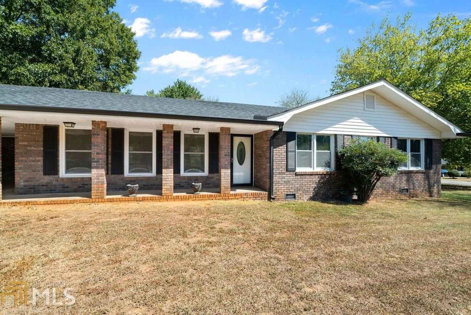 Great ranch style home just outside the city of Cartersville. Four sided brick with large level yard with an additional outdoor storage building as well as storage room in the carport. This home has been remodeled to bring every feature to our modern times! Large open floor plan, completely new and up to date kitchen with stainless steel appliances. Gorgeous bathrooms including tile shower and beautiful vanities. All the windows and exterior doors have been replaced to today's energy efficient standards. New exterior shutters as well as seamless gutters. New interior POCKET doors which maximize space, as well as gorgeous molding throughout. You must see this wonderful home to believe the attention to every detail!