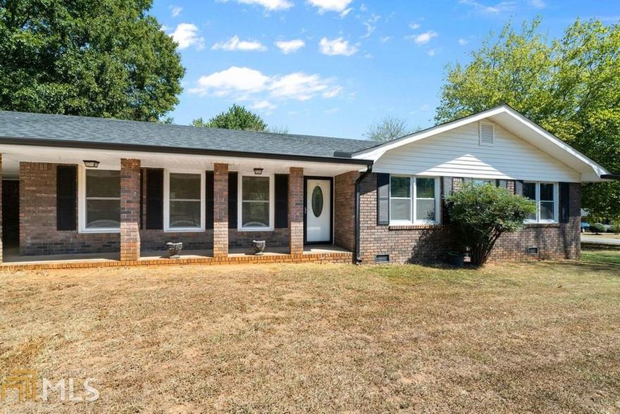 Great ranch style home just outside the city of Cartersville. Four sided brick with large level yard with an additional outdoor storage building as well as storage room in the carport. This home has been remodeled to bring every feature to our modern times! Large open floor plan, completely new and up to date kitchen with stainless steel appliances. Gorgeous bathrooms including tile shower and beautiful vanities. All the windows and exterior doors have been replaced to today's energy efficient standards. New exterior shutters as well as seamless gutters. New interior POCKET doors which maximize space, as well as gorgeous molding throughout. You must see this wonderful home to believe the attention to every detail!
