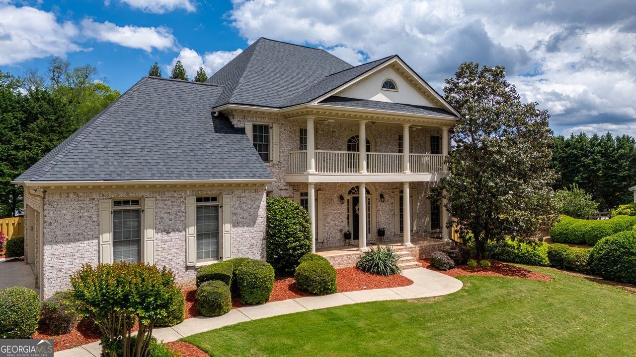 Southern Elegance Meets Modern Comfort in This Alpharetta Gem! Welcome to a home that truly has it all - an Alpharetta address with the benefit of Cherokee County taxes, nestled on a corner lot within a peaceful cul-de-sac. From the moment you arrive, the timeless four-sided brick exterior, charming Southern porch, and second-story balcony create a striking first impression. Step inside and imagine coming home after a long day to your private five-bedroom, five-and-a-half-bath sanctuary. A soaring two-story foyer greets you with elegance, setting the tone for the rest of the home. On either side, you'll find versatile front rooms currently styled as a graceful piano room basking in golden-hour sunlight and a sophisticated sitting area with detailed millwork - could be easily transformed into a formal dining room. The heart of the home is an open-concept kitchen designed for both function and flair. Double ovens, a Bosch appliance suite, large island, and breakfast bar offer everything a home chef could want. With views into the cozy living room - complete with a brick hearth fireplace and streaming natural light - this space is perfect for everyday living and festive gatherings. Upstairs, four generously sized bedrooms each offer their own en-suite bath, providing privacy and comfort for everyone. The primary suite is a true retreat, boasting dual closets (with expansion potential), spa-inspired finishes including dual vanities, soaking tub, and a glass-enclosed shower atop herringbone tile floors. Step onto the front balcony from either the owner's suite or a secondary bedroom and enjoy a quiet morning coffee or evening breeze. The finished terrace level is just as impressive, offering a full bedroom and bath, kitchenette ready to become a full kitchen, a living room, and walk-out access to the covered veranda- ideal for al fresco dining by the pool. Speaking of the outdoors, prepare to fall in love with the resort-style backyard. Fully fenced for privacy, it features a heated, saltwater gunite pool and spa with waterfall accents. Whether you're entertaining guests or simply relaxing with family, this space feels like a permanent vacation. Don't forget the screened-in porch for cozy rainy-day lounging and the expansive back deck stretching the width of the home - your new favorite sunset spot. As a unique bonus, just minutes away you'll find a local equestrian facility offering riding lessons for all skill levels and, when available, boarding options - perfect for horse lovers or those seeking a peaceful connection to the outdoors. This isn't just a house; it's a lifestyle upgrade. From refined details to unbeatable amenities, every inch has been designed for comfort, style, and memorable moments. Come see it for yourself - and start imagining your life here.
