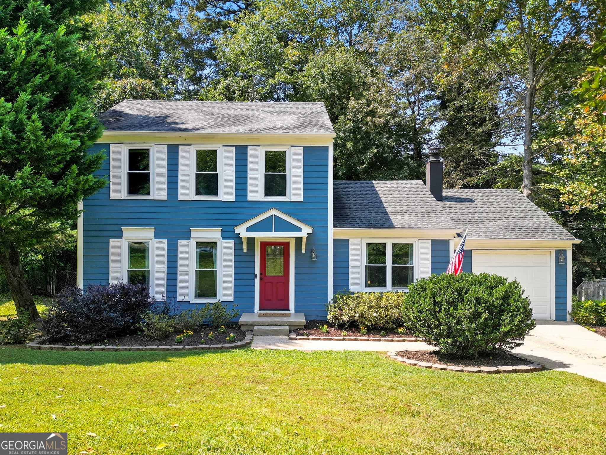 Welcome Home! This is the one you've been waiting for-charming, move-in ready, and full of updates! This delightful 3-bedroom, 2.5-bath home offers both a cozy living room and a spacious family room with fire place, perfect for relaxing or entertaining. The updated kitchen features shaker cabinets, granite countertops, and stainless steel appliances, ideal for any home chef. Step out onto the expansive new back deck-accessible from the dining room-which floods the space with natural light and provides the perfect setting for outdoor dining or weekend gatherings. Additional highlights include a 1-car garage, a newer roof, and a recently replaced water heater for added peace of mind. Zoned for highly-rated Northwood Elementary, Haynes Bridge Middle, and Centennial High School. Best of all? No HOA! Don't miss out on this incredible opportunity!