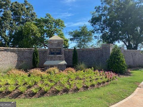 Welcome to the most exclusive new community in the Buford City School district-Bethany Estates. These gated homesites are almost 1 acre and are being offered to build the ultimate in custom homes, with home prices beginning around $2,000,000 each at completion. Room for your pool, extra garages and so much more on these spacious homesites. This 1.40 acre lot has a level driveway that will have the house facing South and is very private and scenic with loads of heavy hardwood trees. Located within minutes to historic downtown Buford-a favorite among locals for dining, shopping area businesses. Numerous golf courses and Lake Lanier is within 2 miles. Marinas are close by so bring your boat! Please contact us today for your exclusive appointment.