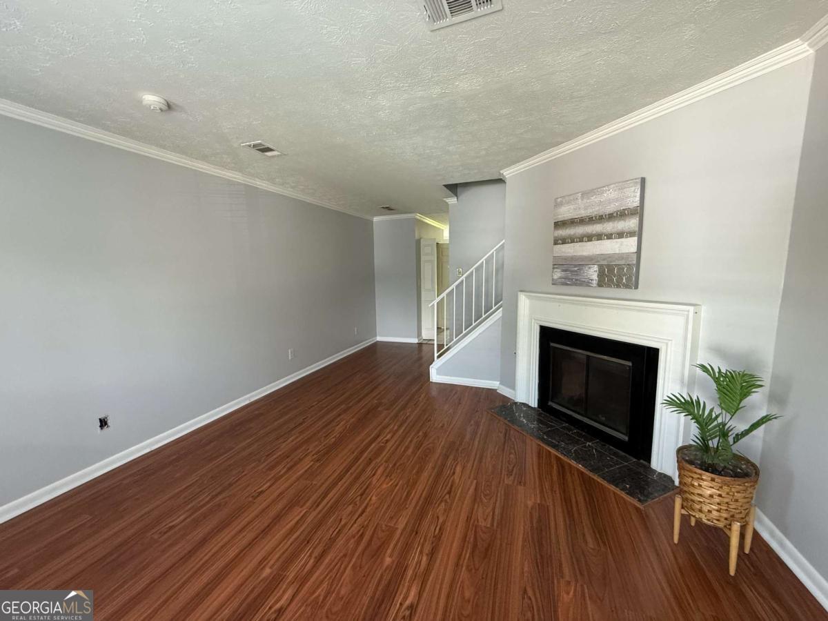 NO RENTAL RESTRICTIONS-PERFECT FOR INVESTORS OR FIRST TIME HOMEBUYERS . STOP RENTING AND START OWNING TODAY!!!." PROPERTY IS ELEGIBLE FOR SPECIAL 100% NO MI FINANCING ". This well-maintained townhouse features a semi- open-concept living and dining area filled with natural light, ideal for everyday living and entertaining. The kitchen offers ample cabinet and counter space with a seamless flow to the dining area. Upstairs, you'll find two generously sized bedrooms, each with its own private en-suite bathroom for comfort and privacy. A half bath on the main level provides additional convenience. A private patio offers the perfect outdoor space for relaxing or entertaining and a storage room . Located in a quiet community, just minutes from I-85, shopping, dining, parks, and historic downtown Norcross, this home is an excellent choice for both investors and buyers looking for affordable homeownership in a prime location.
