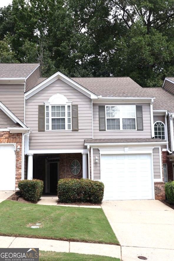 Completely remodeled townhome in a prime Buford location near Mall of Georgia, The Exchange at Gwinnett, Topgolf, Andretti, dining, and top-rated schools with easy access to I-85. This 2 bed / 2.5 bath home features a spacious two-story entrance, new semi-custom kitchen with granite countertops and brand-new appliances. All new luxury vinyl flooring throughout the main level along with brand new carpet upstairs and all new carpet padding. Fresh paint, new blinds, modern lighting, and fully updated bathrooms with brand new vanities and tile flooring. Brand-new HVAC systems with new ducting throughout and a new water heater provide peace of mind for years to come. Upstairs includes two oversized bedrooms with private baths and a versatile loft ideal for an office, media, or library space. HOA covers exterior maintenance, lawn care, pest control, pool, and tennis. No rental restrictions. 1,736 sq ft with single-car garage-move-in ready! Schedule your showing today!