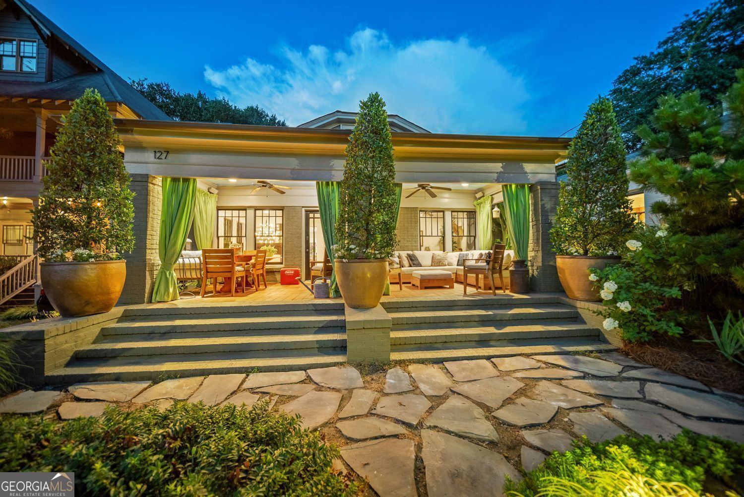 Tucked away on one of Oakhurst's rare cul-de-sacs, this beautifully renovated 3BR/2BA brick home blends thoughtful design, modern comfort, and smart sustainability. The reimagined floor plan opens the kitchen and dining area for seamless entertaining, featuring a gas cooktop, beverage fridge, and abundant storage-including a walk-in pantry/laundry room. The expanded primary suite serves as a private retreat with a spacious walk-in closet, separate shower, and soaking tub. Designed with entertaining in mind, enjoy an inviting front porch, rear screened porch, and a large stone terrace with a built-in firepit. Additional upgrades include solar panels, on-demand water heater, and added insulation-helping to significantly offset utility costs year-round. A large rear storage building adds function, while professionally curated gardens offer privacy, seasonal interest, and two tranquil water features. Cafe lights add evening ambiance for unforgettable outdoor gatherings. Ideally located just a short walk to Oakhurst Village, 2nd Ave Village, and all neighborhood schools. The cul-de-sac is a tight-knit community that even hosts bands each fall for the beloved 'PorchFest.' This home is truly special-but the street is where you'll want to put down roots.