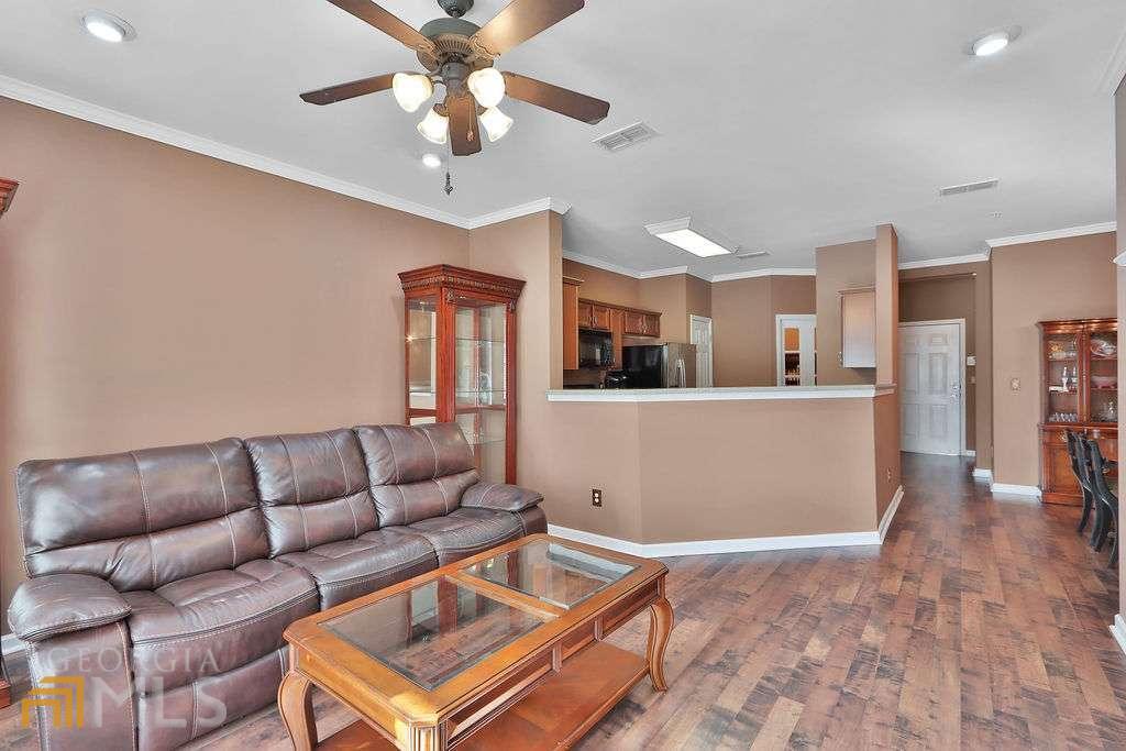 Welcome to the Flats of West Village! This is a must see 1 bed 1.5 bath with a bonus room / office first floor unit. A great value just shy of 1200 sqft with a large master bath , walk -in closet and bonus room. Unbeatable walkability to west Village Square which includes Mccrays tavern, Orange theory fitness, Starbucks coffee, and much more. HOA is $254 a month and includes water, trash, and gas. New HVAC system and water heater. Come check out your future home!!