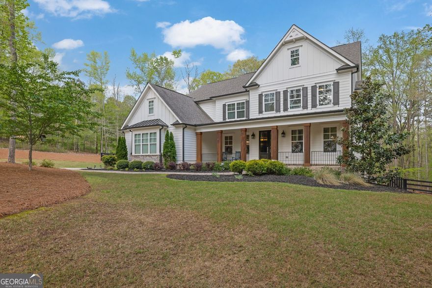 This executive home in Alpharetta is nestled on over 2 extremely private acres with low Cherokee County taxes is a must see. Situated on a cul-de-sac in the very back of a private, gated community, this elegant farmhouse backs up to a 35+ acre parcel, offering unparalleled privacy for you to enjoy your fully fenced 3 rail fenced backyard and pebble tech saltwater pool & spa. Inside, you can enjoy an almost perfect layout with an oversized quartz kitchen island open to a large living room, tucked away dining rooms and offices, as well as a mudroom and guest bedroom with en-suite bathroom on the main. Upstairs, you'll find two jack and jill secondary bedrooms, one en-suite bedroom, and a massive primary suite with an expansive closet and a double entry shower featuring 5 shower heads and a separate soaking tub in front. Full unfinished basement stubbed for bath that's waiting for your touches! Excellent public schools, and only 15min from King's Ridge Christian School as well. Make this your private oasis today.
