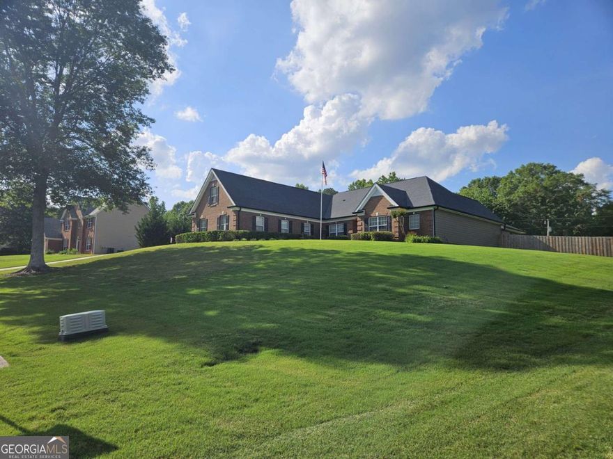 Welcome Home ~ Your Escape Awaits in this Beautiful Quiet Lake Community ~ Enjoy your own private Oasis in this Stepless Ranch Home Nestled atop  a Plateau with Lake Views. This amazing home offers a comfortable and accessible lifestyle with a main floor living split plan- includes -Inviting Spa Master Suite that opens to patio/Humming Bird Garden  w/ Tray Ceilings, Remodeled Bath w/Oversized Tiled Shower, Tiled Floor, Garden tub w/tiled surround, His and Her Vanities & Walk-In Closets, Two secondary bedrooms w/Full Bath &  A Spacious Upstairs Bonus/4th Bedroom, perfect teen/in-law, Guest Suite/Media/exercise or Sewing/Craft Rm.  This Home is Great for Entertaining - Bring the Entire family for BBQs on the 21 x 22 Open patio in your New Private Fenced in Backyard, Unwind on your New Hand Crafted 18 x 13 Covered Porch Perfect for Outdoor Movie Nights or an afternoon Reading.  This Charming Home offers A Grand Entrance leading to Private Home w/French Doors, Opens to a Separate Dining Area w/Elegant Shadow Box Ceiling and Chair Rail Trim, New 5" Hardwoods leading into your Gourmet Eat-in Kitchen W/Oak Cabinets, Stainless Steel Appliances, Granite Countertops, and an  Island overlooking Breakfast Area and Cozy Fireside Keeping Rm. Decompress and kick up your feet in front of your gas fireplace in Family RM. This Home Screams Relaxation.  Newly Installed Roof, Exterior Painted and Gutters Replaced 24, Irrigation System, Plumbed for Central Vacuum, Security System, Keyless Entry Locks, Full Walk-In Attic for Extra Storage, Three Car Attached Garage and  A Three Car Detached Garage w/Keyless Entry -  A Car Enthusiasts Dream - Newly Built 30 X 40 Insulated Garage w/ 10 Ft  Wooden Walls a 16 FT Peak Center -200 AMP Service, Heating /Air, Water, Built-In Cabinets/Shelving w/Sink , Two Lifts ($)- offers Ample space for Various Activities - Woodworking, Hobbyist, Hairstylist, Perfect Man Cave  - She Shed - Could easily be a Carriage House and the Best Part the Home Includes A Separate Entrance off Freeman Johnson - the possibilities are endless in this peaceful fishing community. This Amazing property is conveniently located near I-85 minutes from shopping, dining, Lake Lanier, Road Atlanta, Chateau Elan Winery/Spa, Hour North of Airport.  Hurry and make this Hidden Gem your New Home!