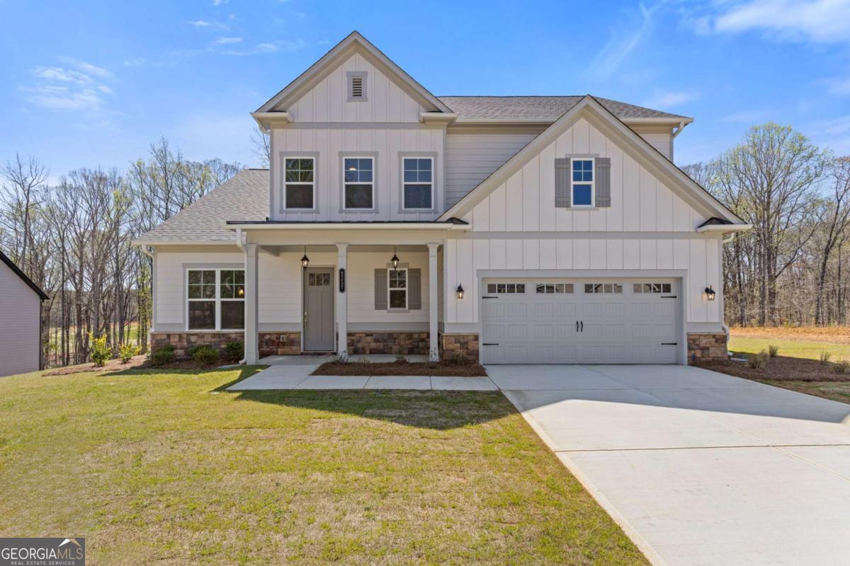 Escape the hustle and bustle in the newly opened phase at Traditions of Braselton! Discover the stunning Newport model by Paran Homes, designed for comfort and style. Relax as you take in serene, wooded backyard views from your spacious gourmet kitchen, featuring a walk-in pantry and an oversized island perfect for culinary adventures. The open-concept layout connects the kitchen to a cozy breakfast area and a warm, fireside family room-ideal for everyday living and entertaining. This well-designed 5-bedroom floor plan includes a guest bedroom and full bath on the main level. Upstairs, you'll find the luxurious primary suite, three additional generously sized bedrooms, a loft, and three more full bathrooms-including a junior suite! Nestled in a premier community, you'll enjoy exceptional amenities: play a round of golf, socialize at the clubhouse, stay active in the fitness center, or enjoy a game of tennis or pickleball. The Olympic-sized swimming pool with a giant water slide is perfect for cooling off and having fun. Experience resort-style living at its best! Visit our model home at 33 Backwater Lane, Jefferson, GA 30549. Hours: Monday-Saturday 10 AM-6 PM Sunday 12 PM-6 PM.