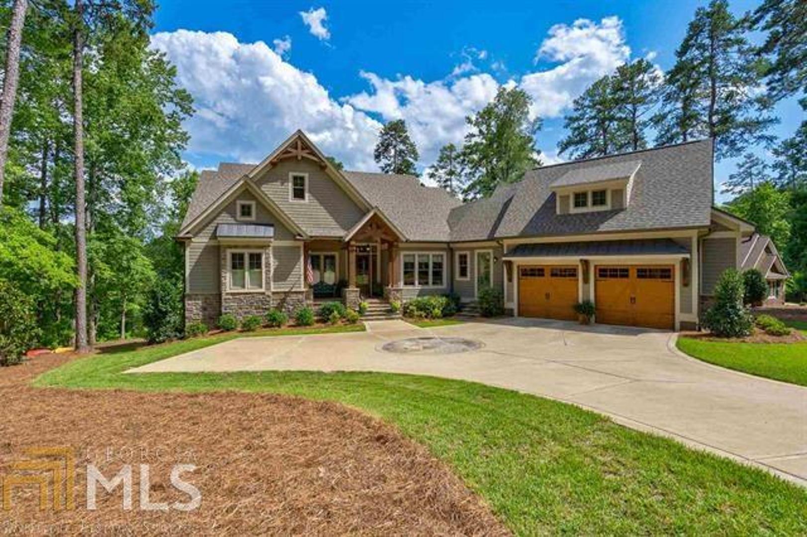 This lovely home in Reynolds Lake Oconee, offers the privacy you are looking for. Built in 2015, the home is located in a cul-de-sac and has an amazing view of the pond to enjoy from the screened porch. The home office features coffered ceilings which will make working from home more enjoyable. Perfect for entertaining guests with a large serving bar on the terrace level. Lake Oconee access is just a short walk away. Start enjoying the lake life and everything Reynolds Lake Oconee has to offer.