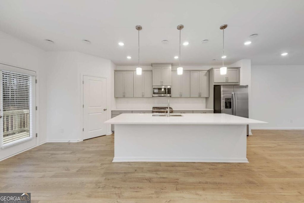 Photo of 1447 Halstead Place #1447, Suwanee, GA 30024 (MLS # 10838280)