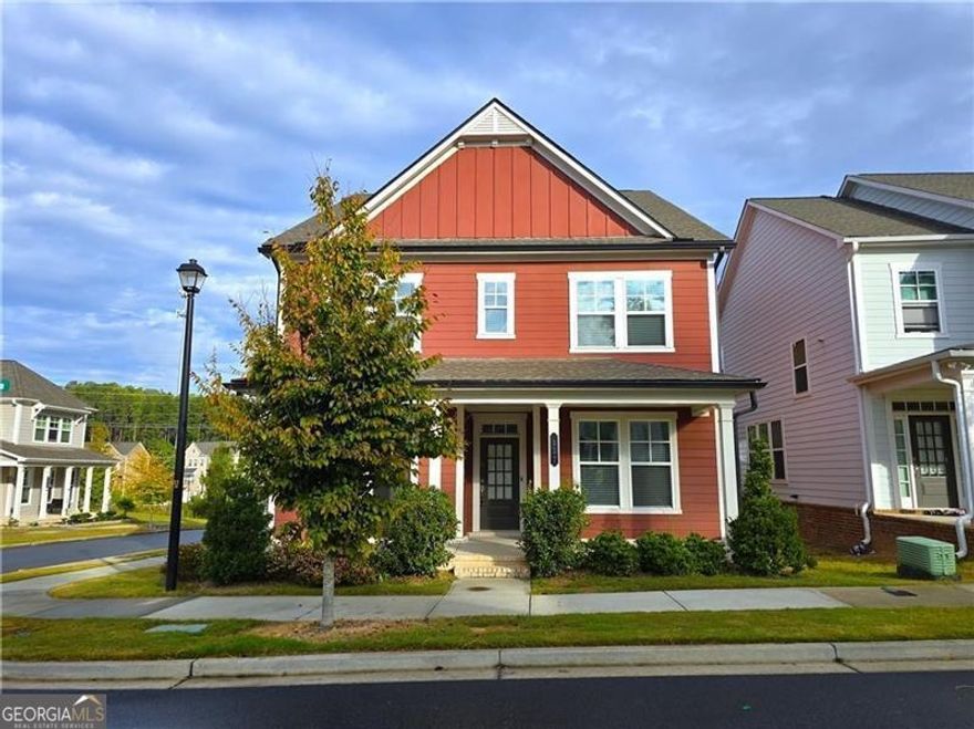 Welcome home to this beautiful, move-in-ready gem in the heart of Suwanee! Perfectly situated near shops, dining, parks, and the lively Suwanee Town Center, this home offers both comfort and convenience in one of Gwinnett County's most sought-after communities with top-rated schools. This charming traditional two-story home features designer upgrades and a bright, open layout that's perfect for modern living. Main Level: Enjoy stunning hardwood floors throughout and a spacious open floor plan that connects the family room, dining area, and a gorgeous kitchen featuring stainless steel appliances. A guest bedroom and full bath on the main level provide flexibility for guests or multi-generational living. You'll also find a convenient mudroom bench by the rear entry, a coat closet near the front entrance, and a versatile flex room ideal for a home office, formal dining, or sitting area. Upper Level: The spacious owner's suite features a large walk-in closet and a luxurious en-suite bath with a beautifully tiled shower and double vanities. Two additional bedrooms share a stylish hall bath, and the upstairs loft offers the perfect space for a media area, playroom, or reading nook. With its thoughtful design, desirable location, and move-in-ready condition, this home truly has it all!