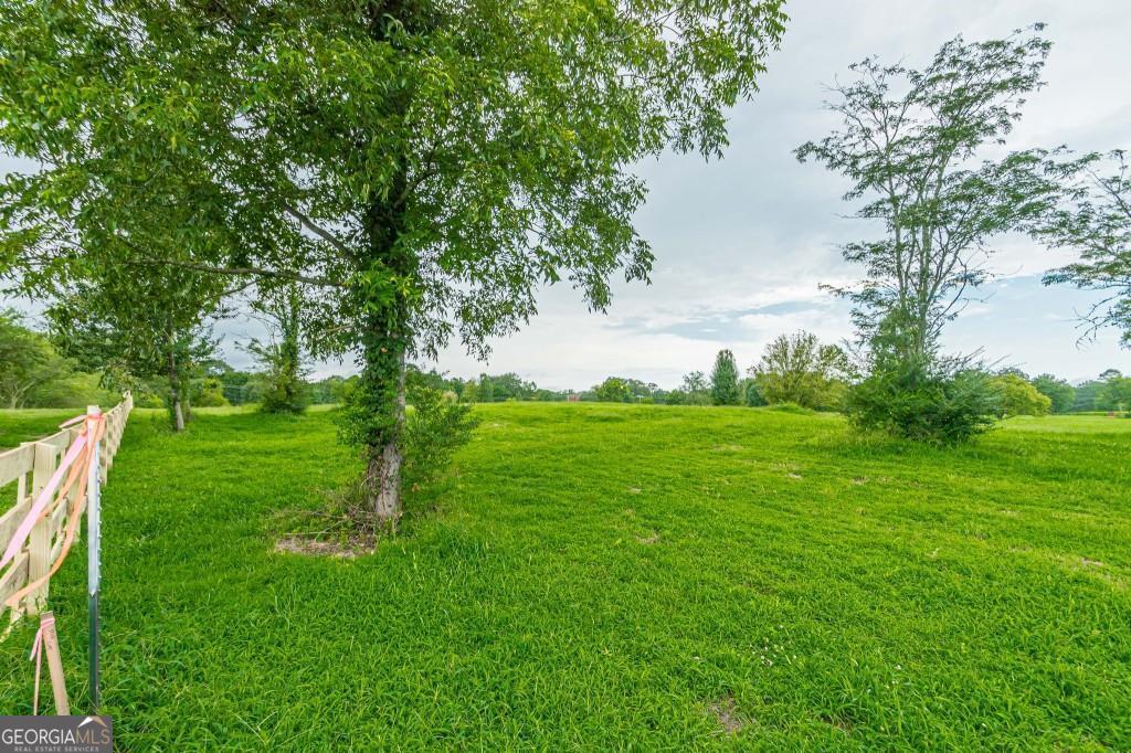 All plans and building permit included in the price. Incredible opportunity to build your dream estate on a private, 3.11-acre lot in the heart of Alpharetta. All plans and approved building permits are included in the price, offering a seamless start to your custom home project. This rare property is surrounded by majestic 150Co250-year-old oak trees, creating a serene and picturesque setting thatCOs rich in natural beauty and history. Tucked away for privacy yet just minutes from top-rated schools, upscale dining, and premier shopping, the location offers the perfect blend of seclusion and convenience. Whether you're seeking a private retreat or a luxury investment, this expansive lot is ready to bring your vision to life.