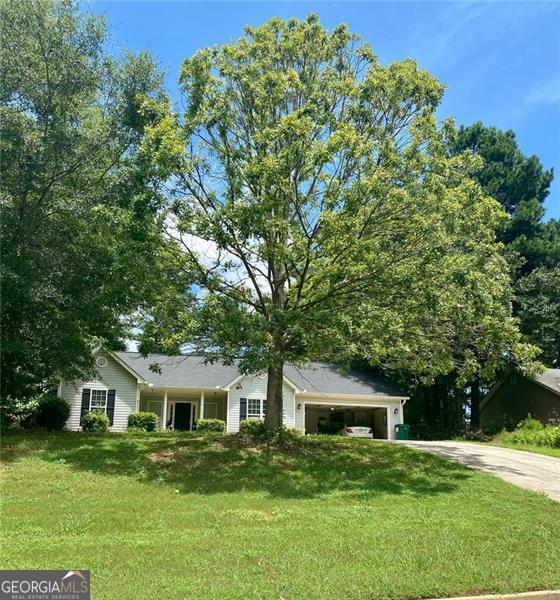 Beautiful STEPLESS Ranch, 3 bedrooms and 2 bathrooms, recently updated by Seller. Enjoy your new chef's kitchen with stainless steel appliances, completely renovated and absolutely stunning. The primary bathroom has also had a make-over and boasts a HUGE shower with rainfall overhead shower fixture. The floorplan is ideal, open, light and bright! The perfectly sized family room has vaulted ceilings and a fireplace for cozy nights. The three bedrooms are all oversized. The dining room has wainscoting and is the perfect gathering place for the family and entertaining, or would make a huge home office. The home sits on over half an acre and the back yard is AMAZING - flat and fenced-in with plenty of room for yard games or to even add a pool. Home has a newer roof and gutters and the septic tank has just been updated and cleaned. This is the perfect home for anyone looking for one level living with NO HOA! Come see it before it is gone!