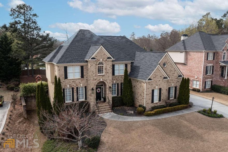 Welcome to a truly exceptional Hamilton Mill residence that exemplifies luxury living at its finest! This remarkable home is the epitome of opulence, boasting an enviable location on a meticulously maintained lot, offering outdoor spaces that are simply sublime for hosting and entertaining in style. Nestled within the prestigious Hamilton Mill golf and tennis community, this home exudes sophistication and elegance, presenting an array of unrivaled amenities and activities for you to enjoy. From the lavish clubhouses to the recreational areas that cater to the entire family, this community offers an abundance of luxurious features including two Olympic-sized pools, sixteen tennis courts, and picturesque walking trails. As you step inside, the magnificent two-story foyer welcomes you with open arms, showcasing new paint throughout and stunning real hardwood floors that exude a warm and inviting ambiance. The living/family room features recently renovated fireplaces adorned with custom shiplap and marble hearths that create a cozy and welcoming atmosphere. The gourmet kitchen is a culinary masterpiece, adorned with brand new black stainless steel appliances, sparkling granite countertops, and a beautifully renovated keeping room that offers the perfect place to gather with loved ones. A guest bed and full bath on the main level make this home perfect for hosting guests. The upper level of this home offers a huge playroom/loft area and generously-sized secondary bedrooms with jack and jill baths, all finished to the highest standard. The oversized master suite is a private oasis, complete with a relaxing sitting room, spa-like bathroom, and a dreamy walk-in closet. This luxurious home also offers a laundry room and newly replaced carpet upstairs, as well as an unfinished basement waiting for your personal touch. A new wood and aluminum privacy fence and refinished back deck provide the perfect setting for outdoor relaxation, while an irrigation system, side-entry three-car garage, smart thermostats, new water heater, and exterior accent lighting further enhance the home's allure. This is an exceptional opportunity to secure a truly breathtaking home in one of Hamilton Mill's most sought-after locations. So why wait? Indulge in the lifestyle you deserve and make this luxurious Hamilton Mill home yours today!