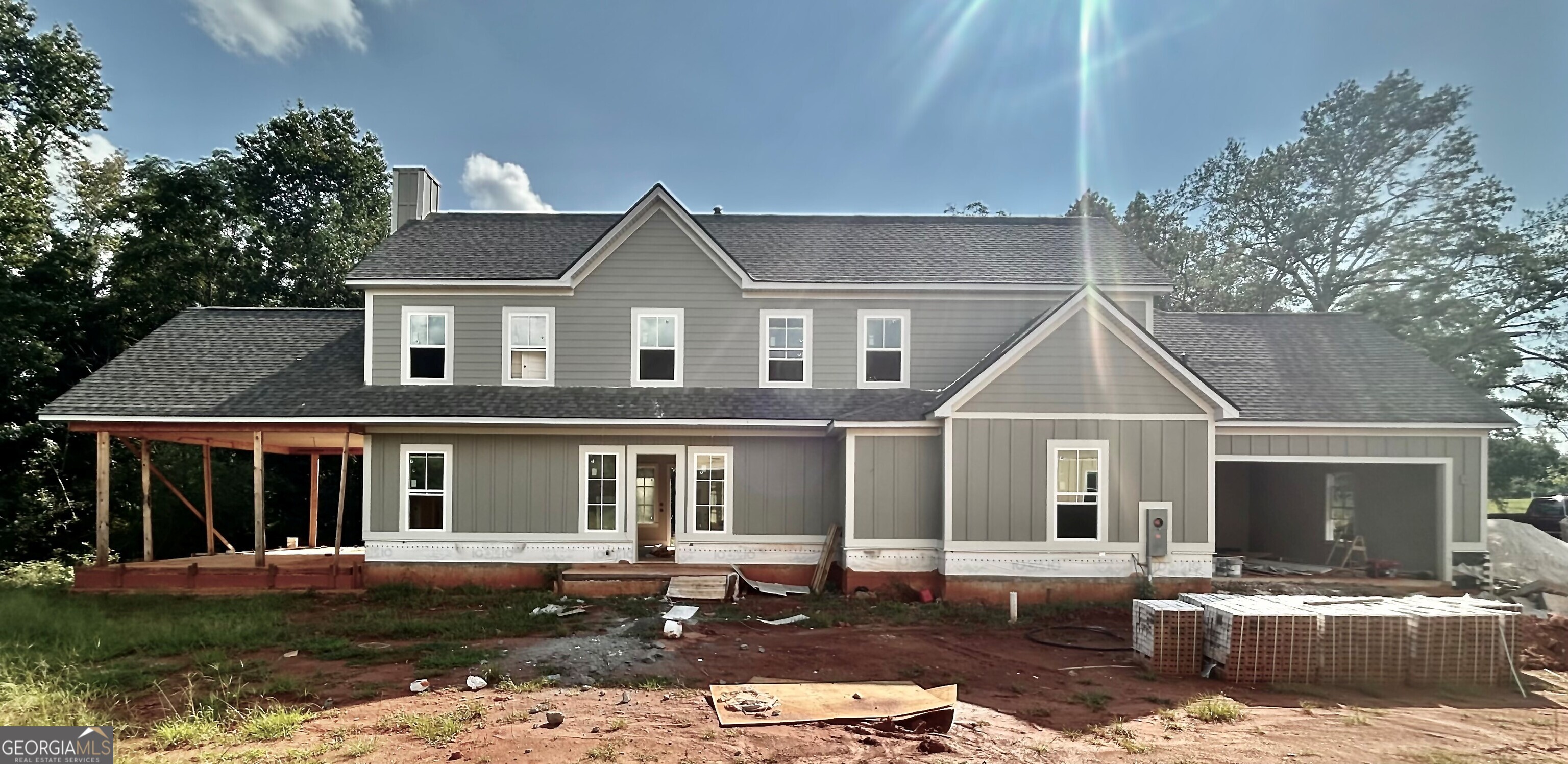 Welcome to Luxury Cottages living in Watkinsville's premiere community Trove. Cottage 4 features the primary bedroom on the main with 4 bedrooms, and 3.5 baths. On the main level is a foyer opening into the family room, gourmet kitchen, family room, office, and primary bedroom. The gourmet kitchen features granite countertops, tile backsplash, an island, a pantry, gourmet stainless steel appliances, and hardwood floors. The primary bedroom has a beautiful bathroom and walk-in closet. Stairs w/ oak handrails and wrought iron spindles lead upstairs. 2nd floor features and a flex area, 3 secondary bedrooms and 2 baths. The exterior features a covered loggia with fireplace. For information and showing call 770-630-2220