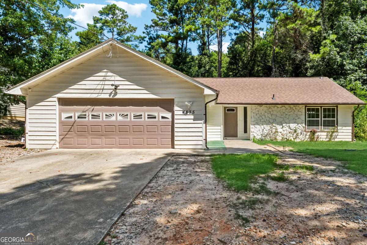 Welcome to 4835 Steve Reynolds Blvd, a fully updated and move-in ready 3-bedroom, 2-bath gem in the heart of Norcross with no HOA and no rental restrictions! Whether you're an owner-occupant or an investor, this nearly 2,088 sqft home offers the perfect blend of comfort, value, and flexibility. Step inside to find all-new double-pane windows, laminate flooring throughout, and a completely remodeled kitchen and bathrooms, including a redesigned pantry. Enjoy modern touches like new doors with updated hardware, upgraded electrical outlets and switches (majority replaced), and new vinyl soffits and gutters installed just 3 years ago. The kitchen features stainless steel appliances, including a 2-year-old stove, less than 1-year-old dishwasher, and a sleek stainless hood vent. The HVAC system is about 3 years old, the roof is approximately 4-5 years old, and the water heater is less than a year old, giving you peace of mind for years to come. Outside, relax or entertain in your private fenced backyard with a spacious 30x14 concrete slab-perfect for outdoor dining, grilling, or future expansion. This home offers a rare combination of space, upgrades, and investment-friendly features, all in a convenient Norcross location. INVESTORS WELCOME!