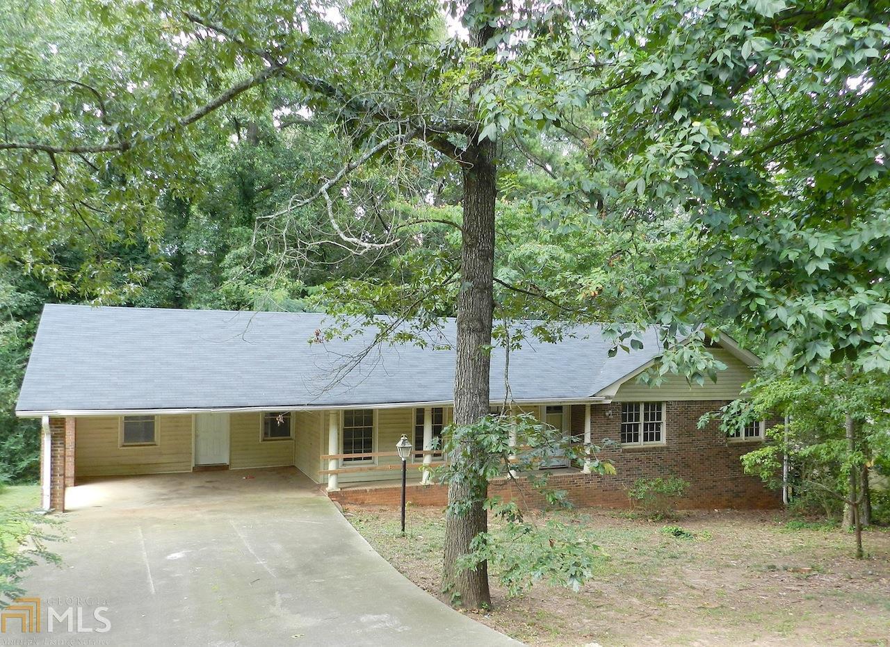 Lilburn 3 bedroom/2 bath ranch nestled on tree shaded homesite. You'll feel like your far from the hustle and bustle yet have all the conveniences your busy life demands. Five Fork Trickum Road, Killian Hill Road and Highway 29 are all within minutes of this home, offering an abundance of shopping and restaurant choices. Return home to the solitude. Shade trees, soothing white kitchen and a dining room waiting for your special touch. Room to grow in the large daylight basement. Call your agent today to learn more about this Lilburn charmer.