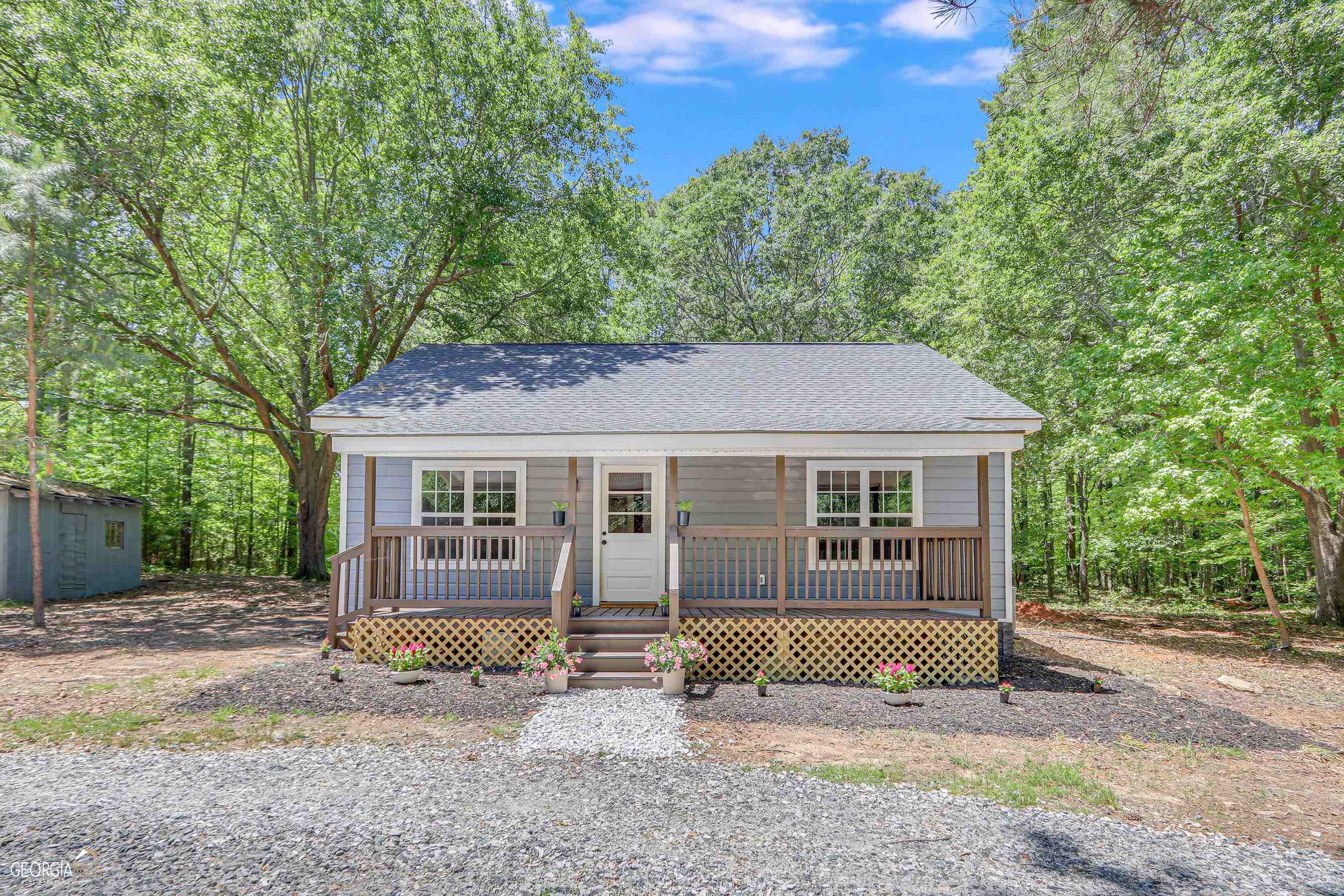 PICTURE PERFECT with rustic charm! Travel down a long gravel circular drive to find a recently RENOVATED home full of 'farmhouse character" & modern touches throughout. MOVE right in & RELAX. The hard work is DONE. ESCAPE the hustle & bustle with a private wooded 1 ac lot just waiting for a new owner to ENJOY. BRING the rocking chairs for front porch sitting. Plenty of room to park the boat or camper if needed. Minutes from Hartwell for entertainment, restaurants, schools & shopping. Convenient to I85. This home is located in the North Hart school district. Don't wait...schedule your showing TODAY!