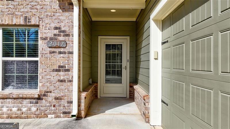 The low-maintenance lifestyle you've been looking for awaits you in this stunning retreat in sought-after Grove Park, a 55+, amenity rich community in Marietta. This light, bright, and open "Magnolia" floorplan home is the larger floorplan available in the community and offers elegance throughout. This home shows like a model home and is ideal for hosting friends & family for all occasions, boasting one-level living plus a finished 2nd-story loft! This home features a coveted covered back patio with sliding glass windows for the perfect indoor/outdoor living space to enjoy year-round! Beautiful hardwood floors are further complimented by tall ceilings, a spacious kitchen with tons of prep space, stained wood cabinets, under cabinet lighting, stainless steel appliances + huge walk-in pantry. You'll love all the finished storage space on the main level and upstairs. All exterior building/roof maintenance and yard maintenance included in your monthly HOA dues + water/trash/sewer! Grove Park features gated access and a beautiful Clubhouse with catering kitchen, gym, and library; a swimming pool; a dog park; a composting area; and walking paths throughout the community. In addition to loving your turn-key home, you will love the convenience to the dining, entertainment, and attractions of Historic Marietta Square (10-minute drive!). Plus, you can take advantage of the proximity to hiking trails around Kennesaw Mountain or go shopping at The Avenue West Cobb! Washer, Dryer, and Deep Freezer also come with this impeccably maintained home, making it move-in ready for you!