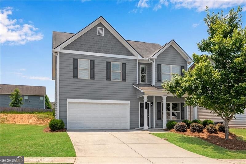 Chafin Communities Resale - Popular Bridgeport Plan located next to neighbor open space! Rocking chair front porch opens to the foyer adjacent to flex room w/closet ideal for home office or formal dining. Wood look vinyl on entire main level. Island kitchen w/tile backsplash, large pantry and NEW built-in appliances views the fireside great room. Fridge included! Breakfast area w/access to the rear patio. FRESH PAINT THROUGH-OUT + NEW CARPET UPSTAIRS! Upstairs laundry! Oversized Primary Suite w/tray ceiling and HIS & HER walk-in closets! The Primary bath offers double vanity, 5' shower w/glass doors. HOA mows the grass!