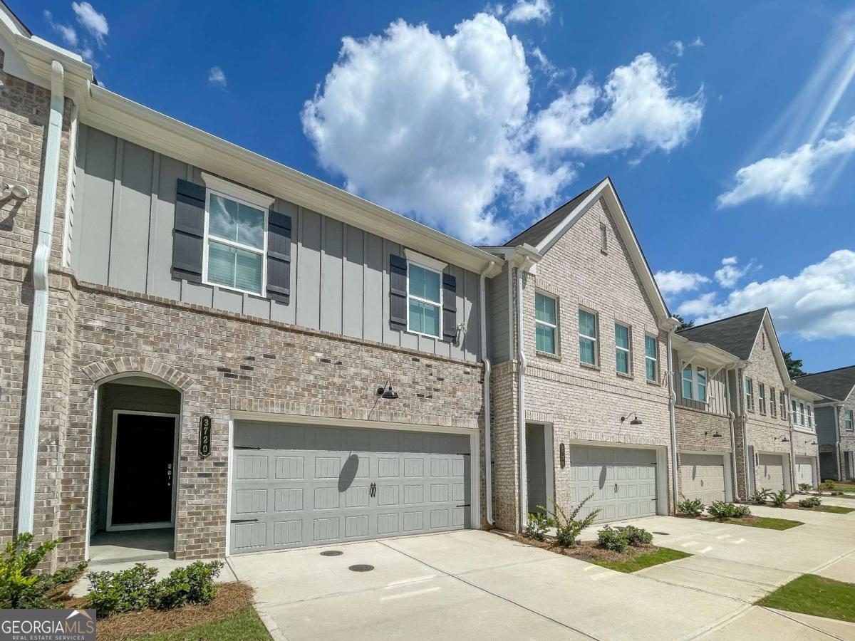 Charming 3-Bedroom Rental Townhouse in a Prime Location This beautiful new construction 3-bedroom, 2.5-bathroom townhouse offers spacious living with modern amenities. Located in a desirable neighborhood, the home is perfect for families or professionals seeking comfort and convenience. As you step inside, you're greeted by an open-concept living and dining area with plenty of natural light, ideal for relaxing or entertaining guests. The well-appointed kitchen features stainless steel appliances, ample cabinet space, and a breakfast bar, perfect for morning meals or casual gatherings. Upstairs, the master suite offers a private retreat with a walk-in closet and an en-suite bathroom with a double vanity. The two additional bedrooms are generously sized with closet space and share a full bathroom. A half-bath on the main floor adds extra convenience. Outside, enjoy a private patio for grilling, outdoor dining or relaxation. The townhouse also includes a garage for two cars, with additional parking available. Located close to shopping, schools, parks, and major commuter routes, this townhouse offers the perfect blend of suburban tranquility and urban convenience. Don't miss out-schedule a viewing today! ***Photos are stock photos of model unit.***