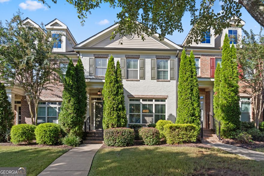 PAINTED BRICK TOWNHOME WITH A PRIVATE COURTYARD IN POPULAR JAMESTOWN. WALK TO NEIGHBORHOOD AMENITIES, THE BIG CREEK GREENWAY OR EVEN HALCYON! Prestigious Alpharetta address with Forsyth County taxes! Both the front and rear entries are on the main level - ideal for greeting guests for bringing in groceries. The main level features hardwood flooring throughout, a kitchen open to the family room, a formal dining room, powder room, and French doors out to an enclosed brick courtyard. In the kitchen you'll find stainless appliances, under cabinet lighting, a breakfast counter, and plenty of counter space for cooking or entertaining. The family room has custom bookcases, a gas fireplace, and a window overlooking the courtyard. The spacious formal dining room could easily be used as a home office. Upstairs you'll find three bedrooms and two full baths. The primary suite offers dual vanities, large shower, soaking tub, and a with walk-in closet. The laundry room is conveniently located on the upper floor near the bedrooms. It's hard to find a better community than Jamestown, with its gated entry, pool, tennis/pickleball courts, playground, dog park, and sidewalks. Outside the neighborhood, sidewalks allow you to safely stroll to the greenway or Halcyon. You'll also have easy access to GA 400 and The Gathering, a dining and entertainment mecca that is currently in the works! The lawn care is provided by the HOA. The lock-and-go lifestyle is waiting for you!