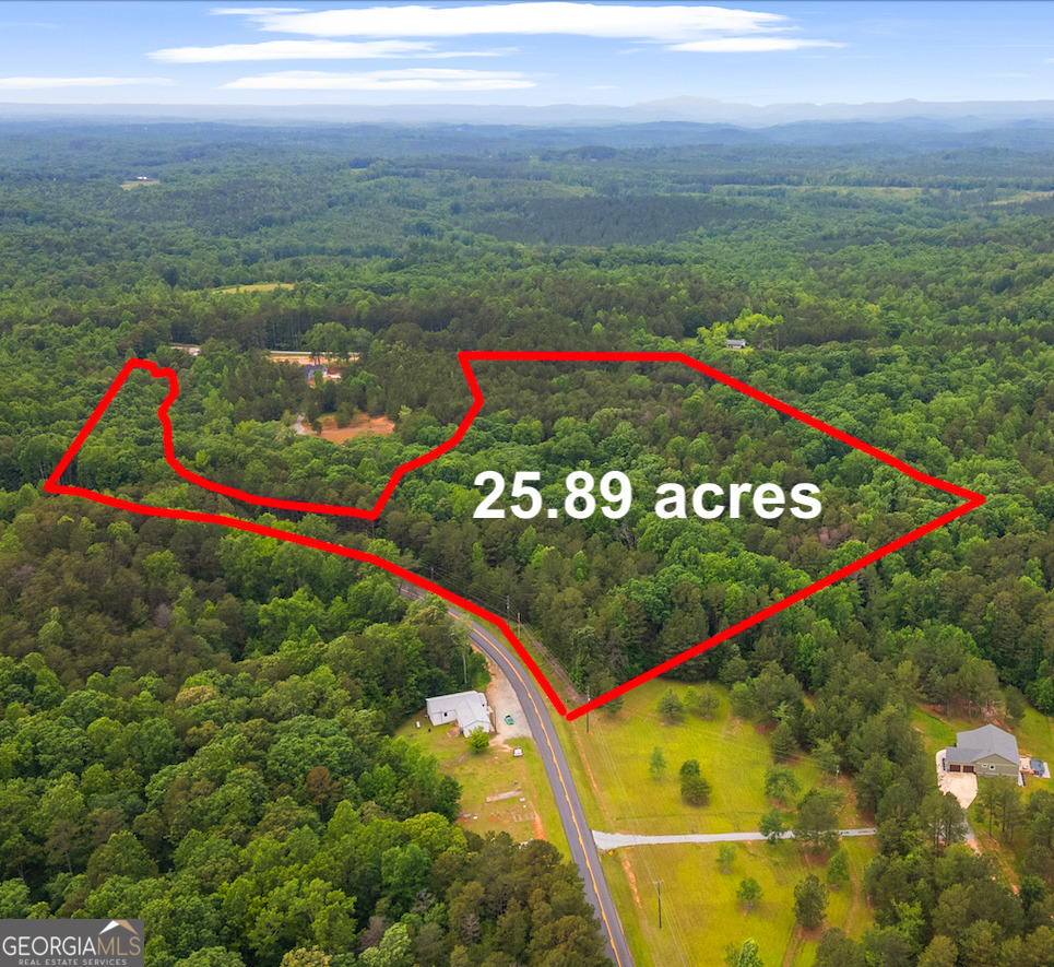 This 25.89-acre property in south Stephens County is just minutes from Lake Hartwell. A natural mix of hardwood and pine covers every inch of the property, and it has paved road frontage on both Bruce Road and N. Holcomb Drive. The road frontage on Bruce Road is approximately 386 feet, while the road frontage on N. Holcomb Drive is over a quarter of a mile at 1,509 feet. This property offers peaceful seclusion and is an excellent opportunity to build your dream home with substantial acreage. Current survey is on file. Zoned AG/AR. Please contact Davis Heric for more details.