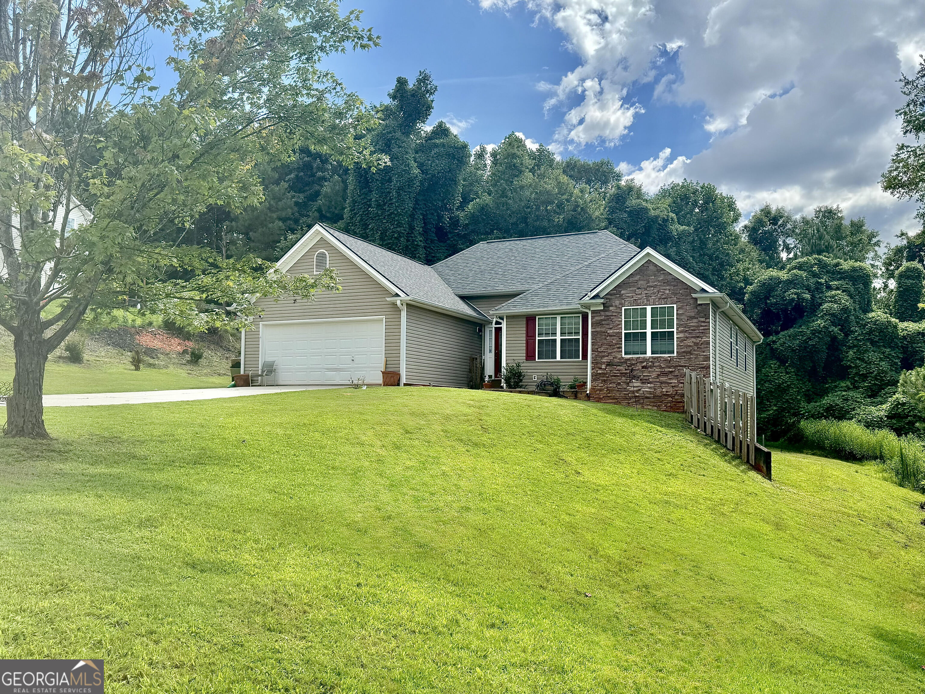 Don't miss this adorable 3-bedroom 2 bath home ranch with a finished basement situated on just over an acre lot with NO HOA! Basement has a kitchen area, living room 3 bedrooms, and one full bathroom perfect for an additional family! HVAC and roof replaced 5 years ago! Owner added exterior staircase from deck to basement. Open concept: you'll love the abundance of natural sunlight and soaring ceilings in the living room. Enjoy your favorite drink on a lovely screened in patio overlooking the large, beautiful backyard. Large primary bedroom, ensuite featuring garden tub, separate shower, double vanity, and walk-in closet.