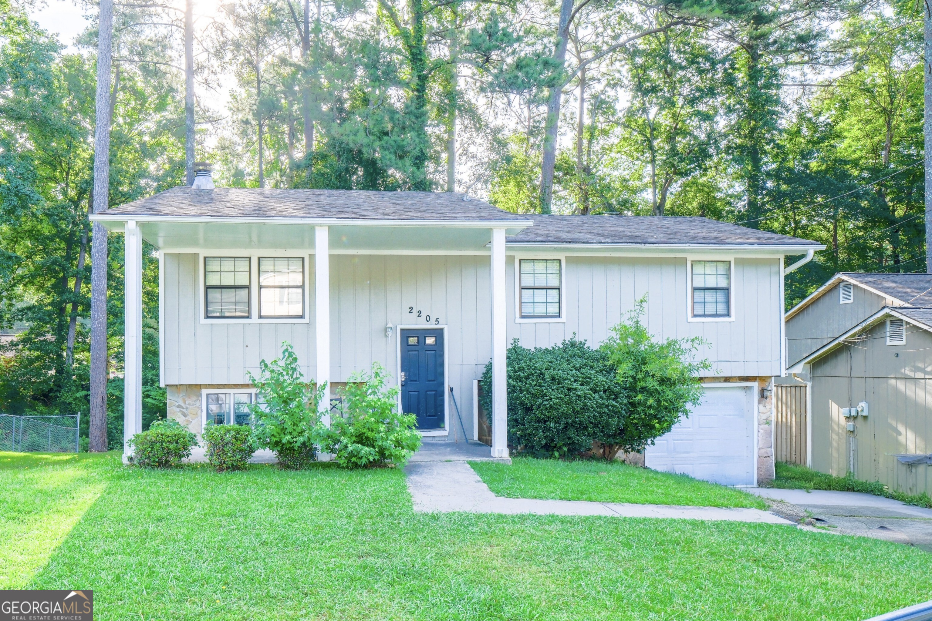This 7-bedroom, 2.5-bath coliving investment property is located in a quiet, established neighborhood of Lithonia and features a practical split-foyer layout ideal for shared housing. A spacious living area provides room to gather, while full bathrooms on both levels support functionality for multiple tenants. With a layout designed to maximize occupancy, this property offers strong potential as a long-term rental. Based on average room rates and vacancy for the 30058 zip code, projected gross revenue is approximately $48,000 per year. Showings are restricted to common areas only; bedrooms are off-limits.