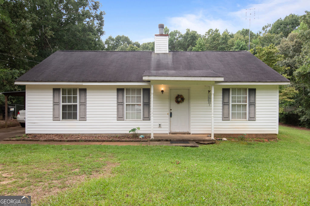 Adorable stepless ranch close to EVERYTHING SENOIA! Situated on just over an acre lot, this 3 bedroom, 2 full bath cutie is ready for you to move in and enhance it with your own personal touch! Features include a spacious great room with wood burning fireplace*nice sized kitchen with eat in breakfast room and pantry*Laundry closet off of kitchen area*Split bedroom plan offering privacy to the primary bedroom with walk in closet and en suite featuring vanity and tub/shower combo *Hall bath with tub/shower combo*Newer vinyl flooring has been installed in the living room, hall and primary bedroom*All appliances remain including the washer & dryer*Enjoy early fall evenings from the sweet little screened porch and admire the large level backyard that is mostly fenced*Move in and spruce up it up with a little paint and elbow grease! Just minutes to historic Downtown Senoia and the new Publix shopping center, you can be close to it "ALL!"