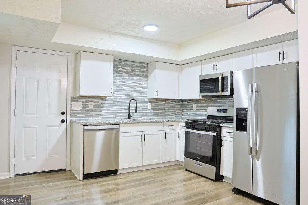 Photo of 4411 Flakes Mill Road, Ellenwood, GA 30294 (MLS # 10780187)