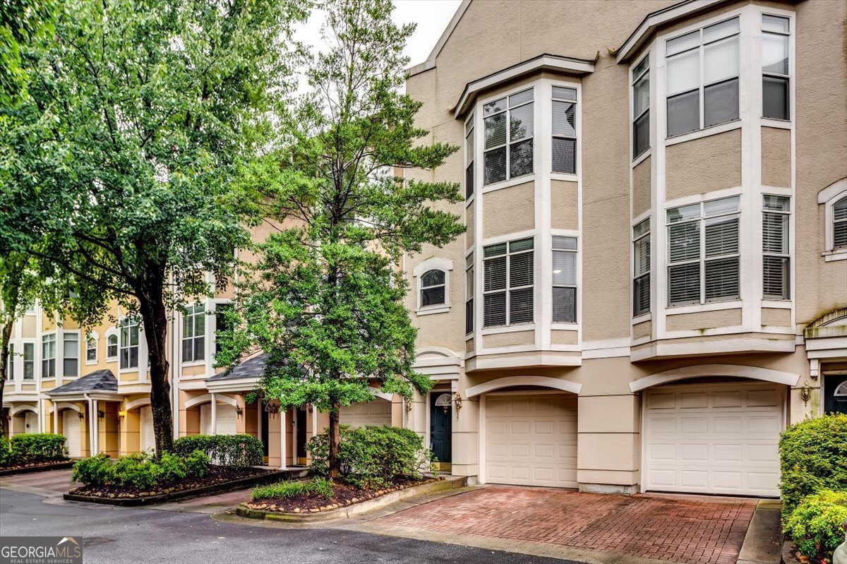 Stunning 3 bedrooms/3.5 bathrooms Townhome in Prime Intown Atlanta Location-----Welcome to Highland City View Townhomes - a gated, amenity-rich community perfectly situated between Old Fourth Ward, Inman Park, and Downtown Atlanta, just minutes from the Beltline, Freedom Park Trail, and Krog Street Market-----This beautifully updated, spacious townhome boasts, 3 bedooms/3.5 bathooms, custom upgrades throughout, and one-car garage parking with ample storage. Designed for both comfort and entertaining, the open-concept main level features: Rich hardwood floors, Designer lighting and paint finishes, Stainless steel appliances, granite countertops, and tile backsplash in a chef's kitchen & Separate dining room-----Charming powder room with upgraded vanity-----Flooded with natural light from oversized bay windows in both the front and back, the living space flows effortlessly for gatherings or relaxing evenings at home-----Upstairs, the split-bedroom layout offers privacy and flexibility. The oversized primary suite is a serene retreat with views, tray ceiling, dual walk-in closets, and a spa-like bath featuring a standalone soaking tub, dual vanity, and luxuriously tiled shower. The secondary bedroom includes its own en-suite bath and large walk-in closet - ideal for guests or roommates-----The finished terrace level includes a third bedroom or bonus room with direct outdoor access, perfect for a home office, gym, or media space. Enjoy two outdoor living spaces - a sunny deck off the dining room and a covered lower patio ideal for pets or quiet evenings-----Community amenities include: Gated access, Pool and fitness center-----Recently updated clubhouse. With top-tier finishes, unbeatable location, and city views. Come see what intown living is all about and make this exceptional home yours today-----Top "A" Rated Middle School & Top "A" Rated High School on Niche (7 Rated Middle School & 7 Rated High School on Great Schools)