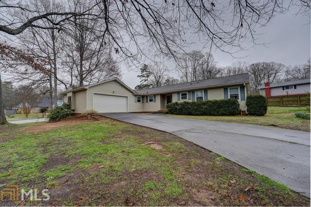 This beautiful well maintained ranch is ready for it's new owners. You will feel right at home when you walk through the door. 3 bed 2 bath. Harwood floors in kitchen, living room and master bedroom. Ceramic tile in baths. Dark wood trim compliments. You don't want to miss this Gem. There is an additional lot that goes with the sell of the home. 0012A00000126000 It is .17 acre. Total of .63 acre. HVAC is 2-3 years old. Keyless entry at the garage. Garbage disposal in kitchen sink.